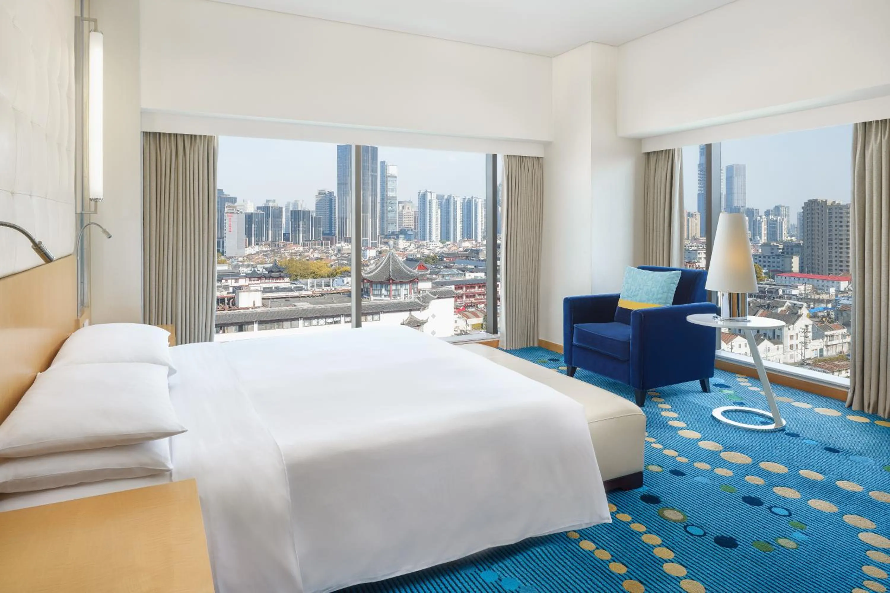 Bed in Renaissance Shanghai Yu Garden Hotel on the Bund