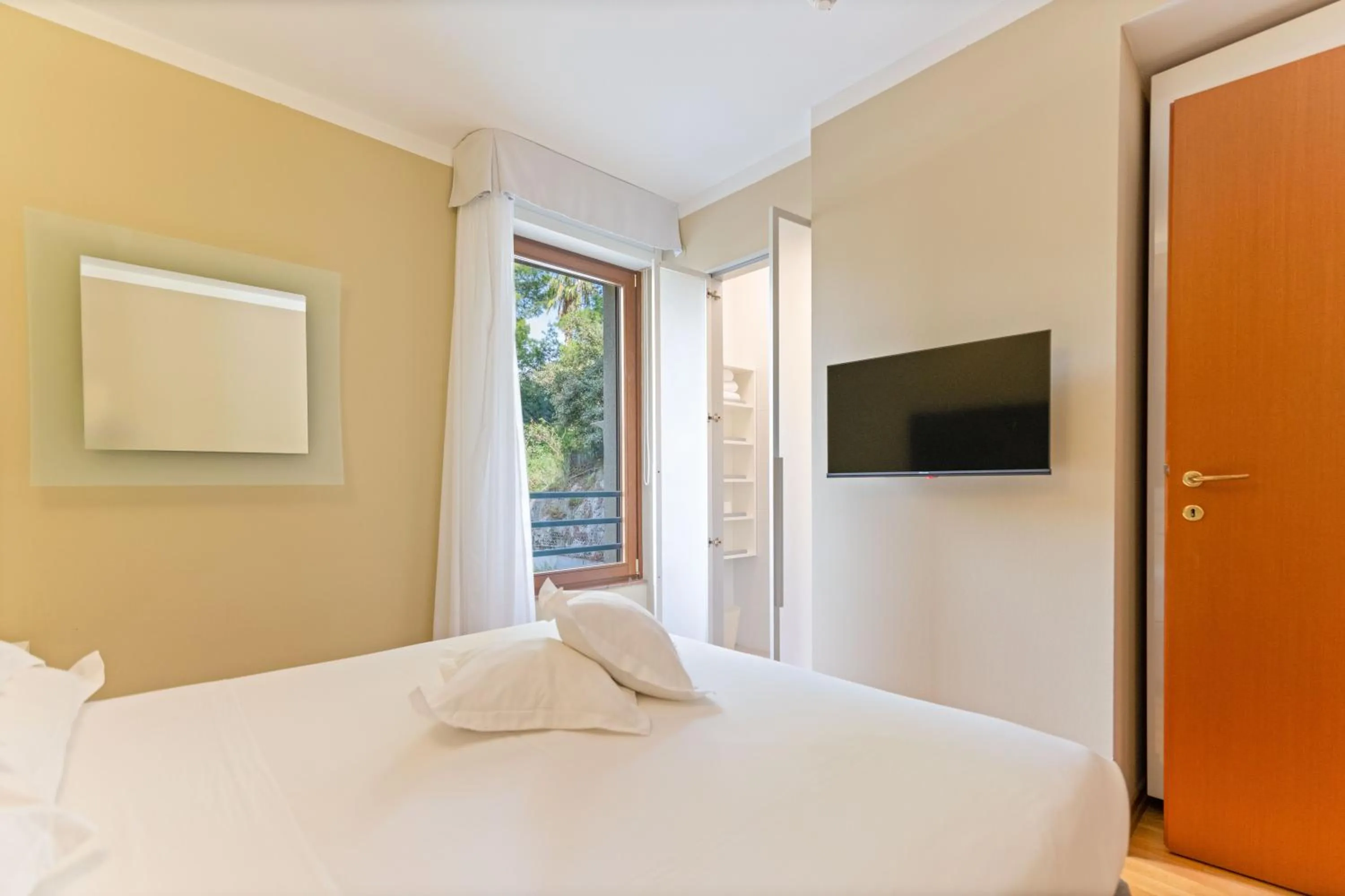 Bed in The Residence Aparthotel