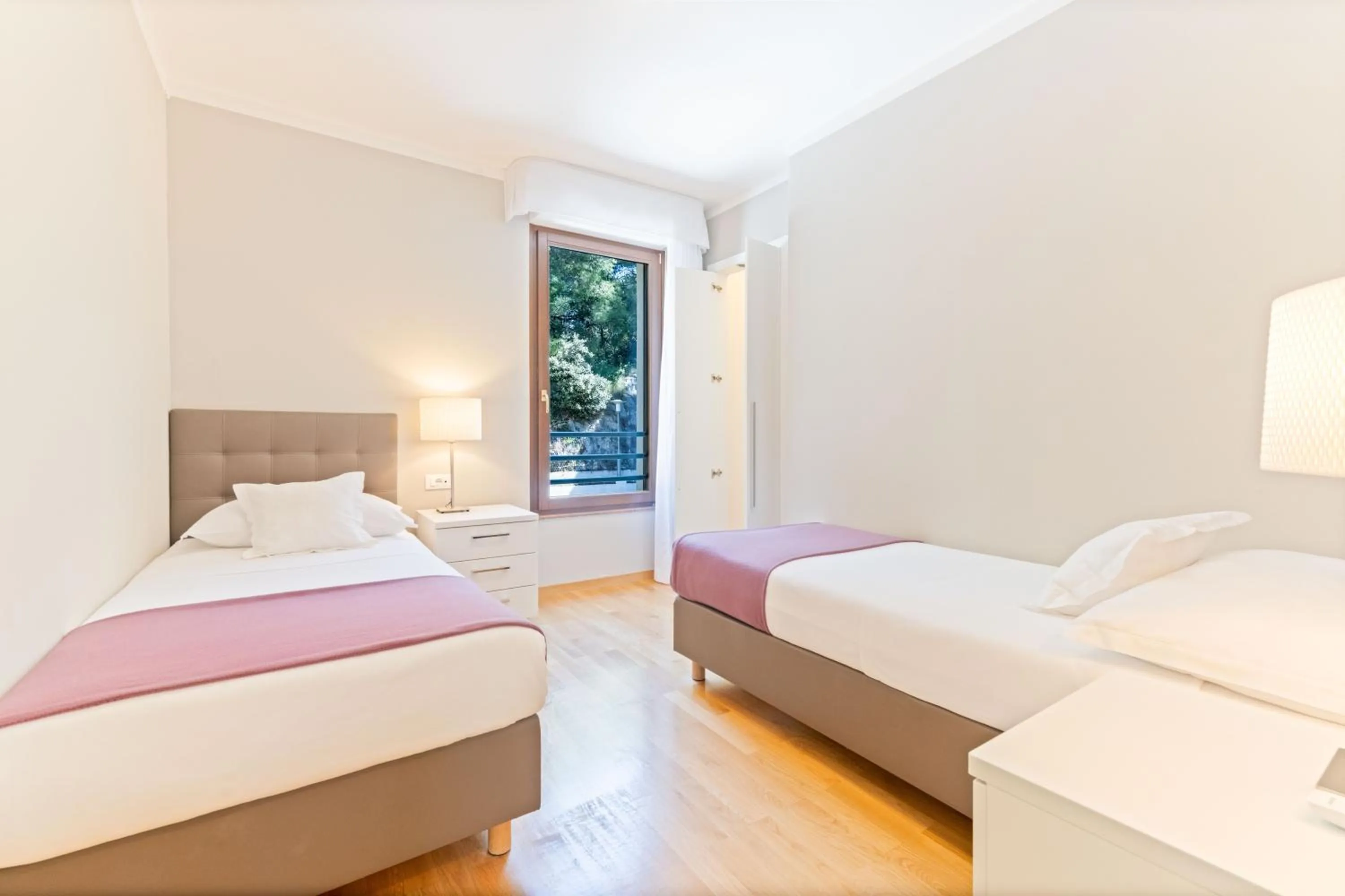 Bed in The Residence Aparthotel