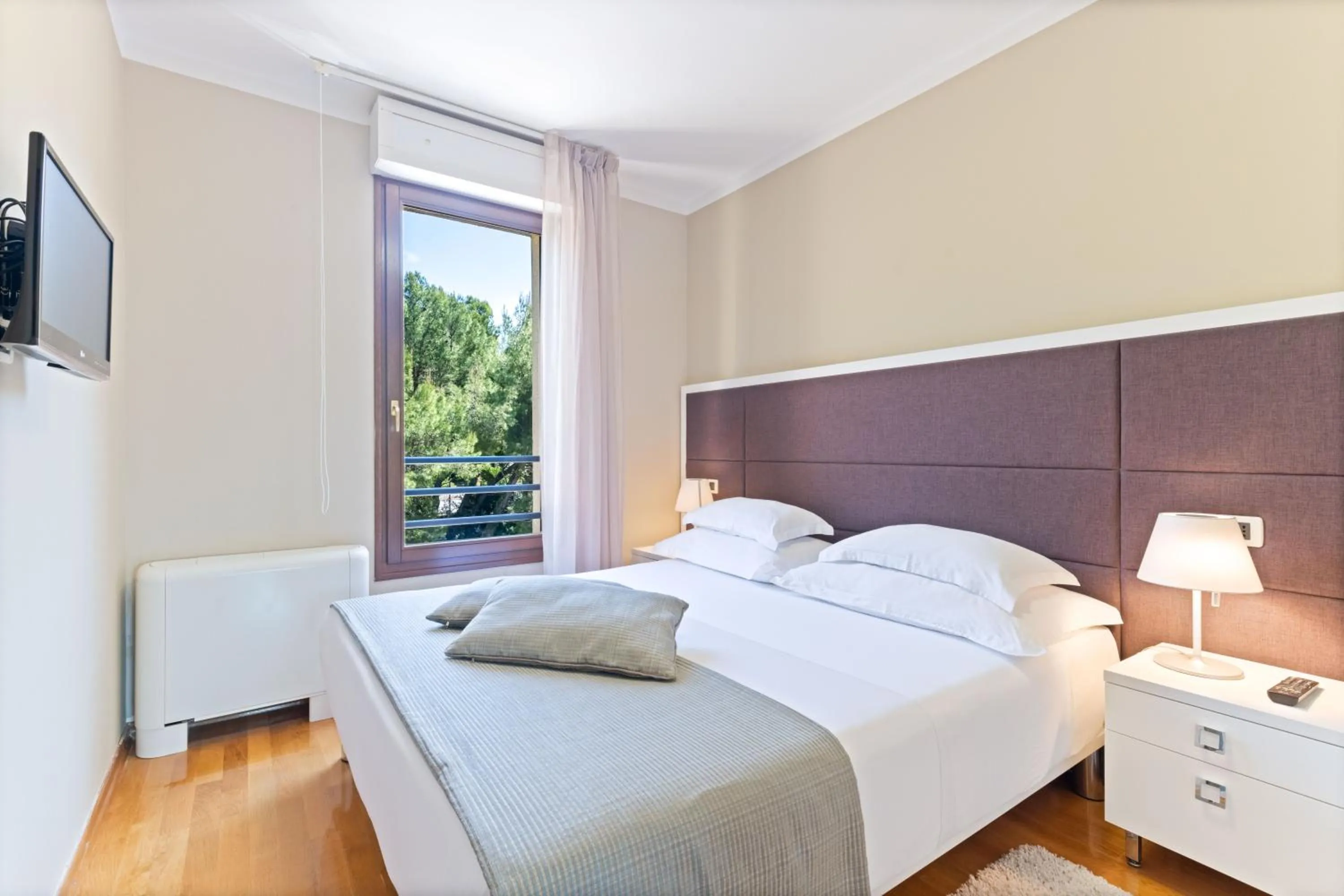 Bed in The Residence Aparthotel