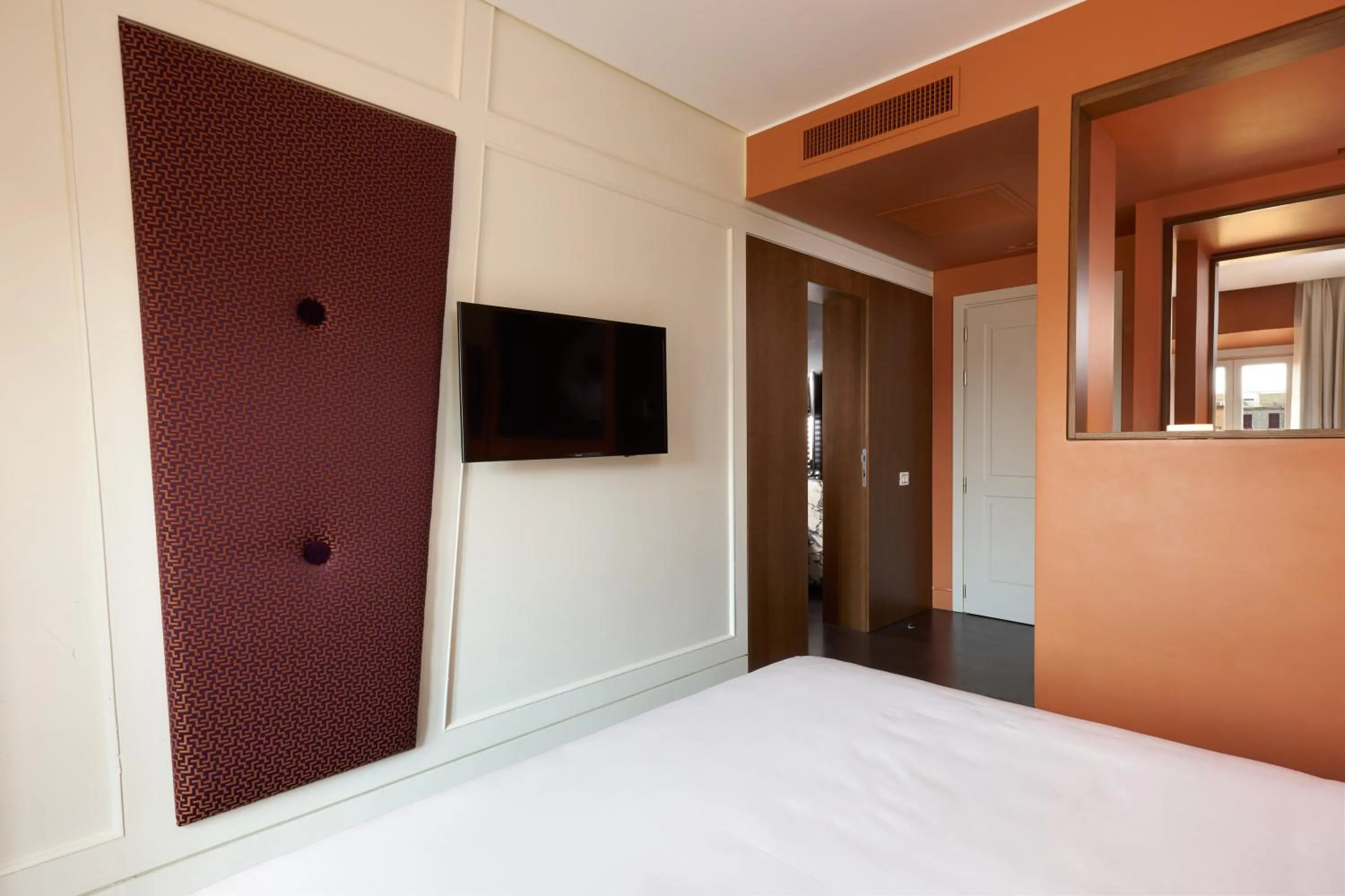 Bed in Mascagni Luxury Rooms & Suites