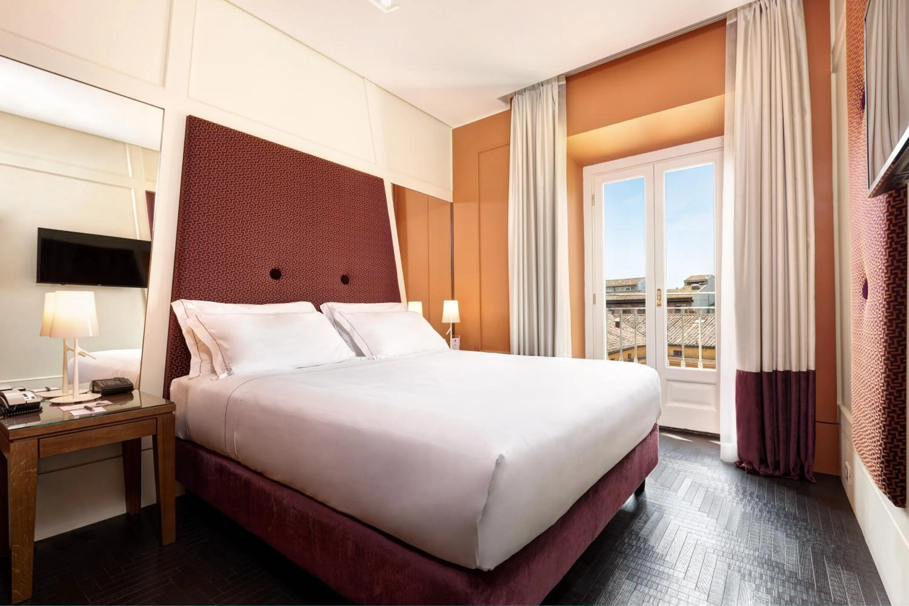 Bed in Mascagni Luxury Rooms & Suites