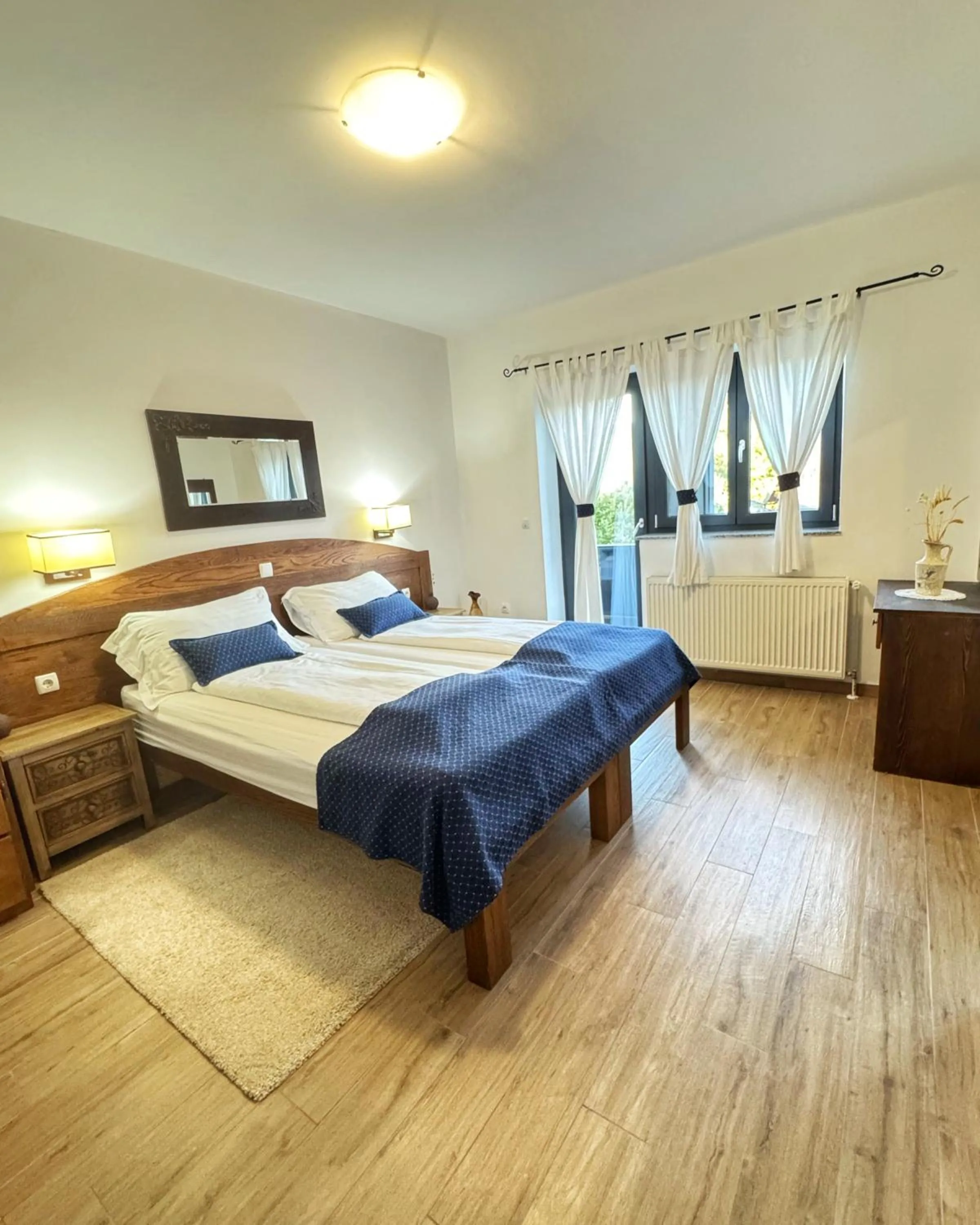 Bed in Etno Garden Apartments