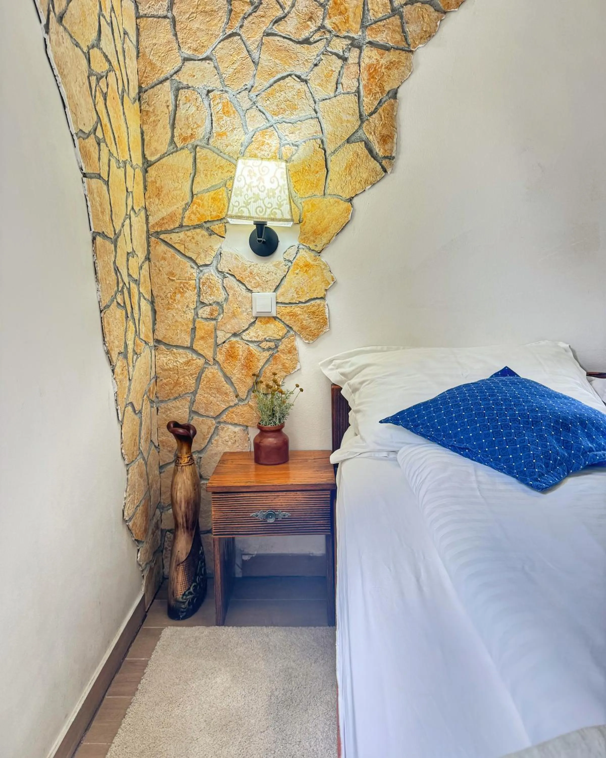 Bed in Etno Garden Apartments