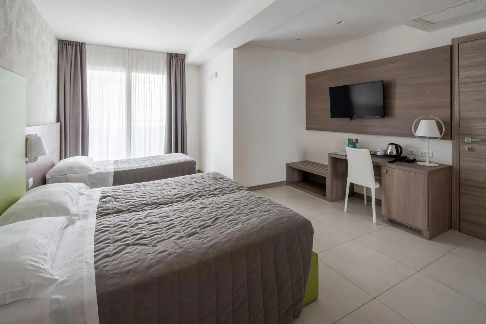 Bed in Hotel Iris Jesolo