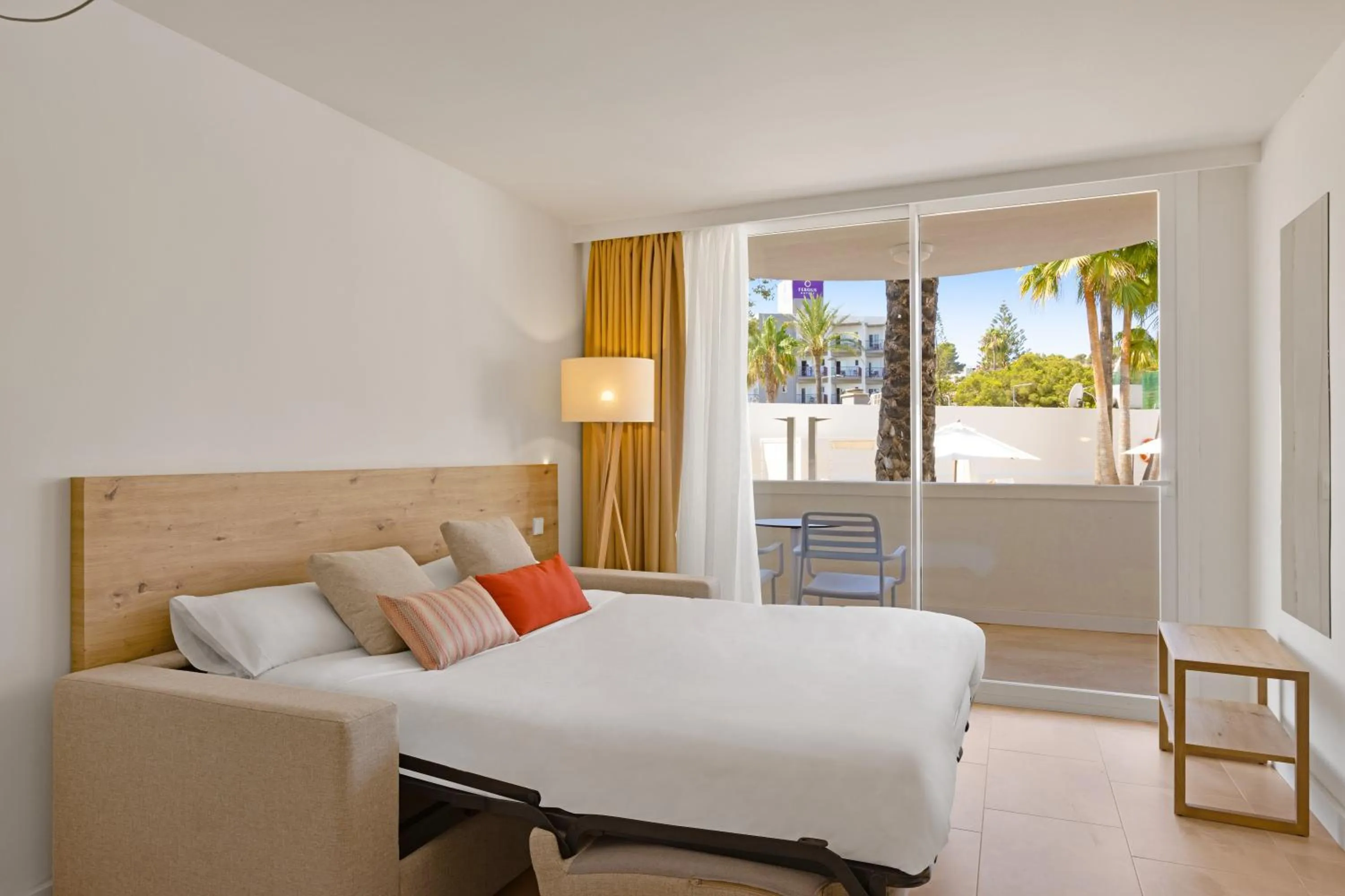 Living room, Bed in Palmanova Beach Apartments by TRH