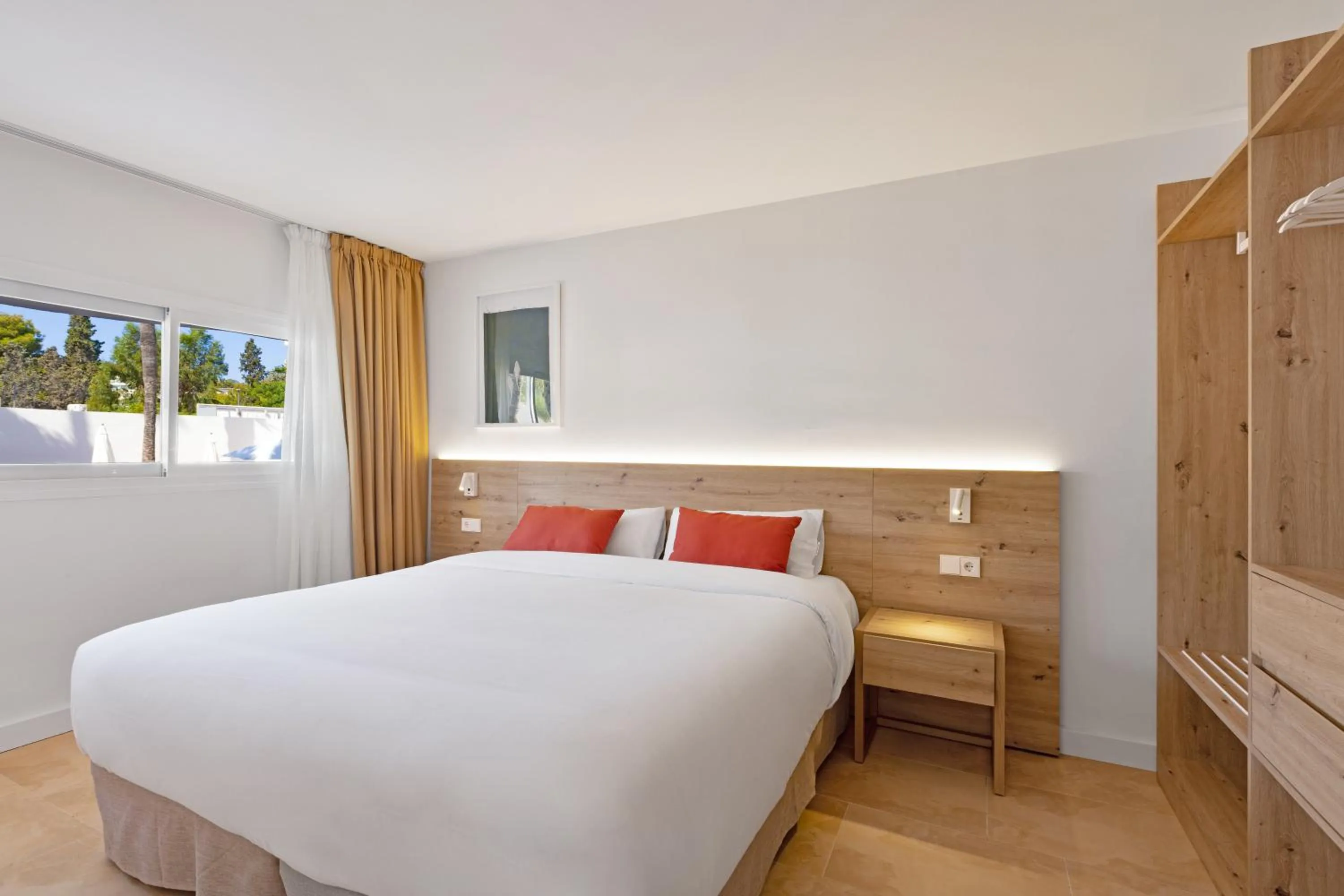 Bed in Palmanova Beach Apartments by TRH