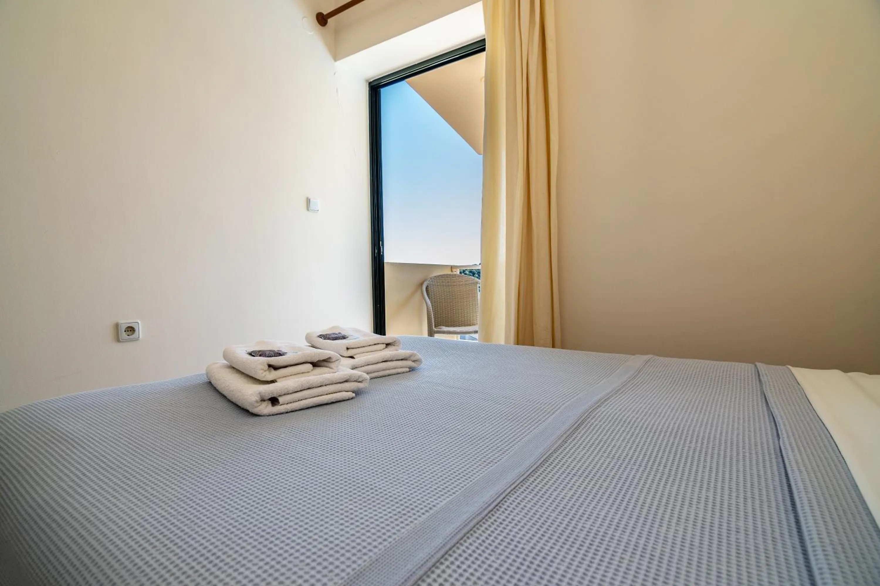Bed in Orestis Hotel Sea View Apartments