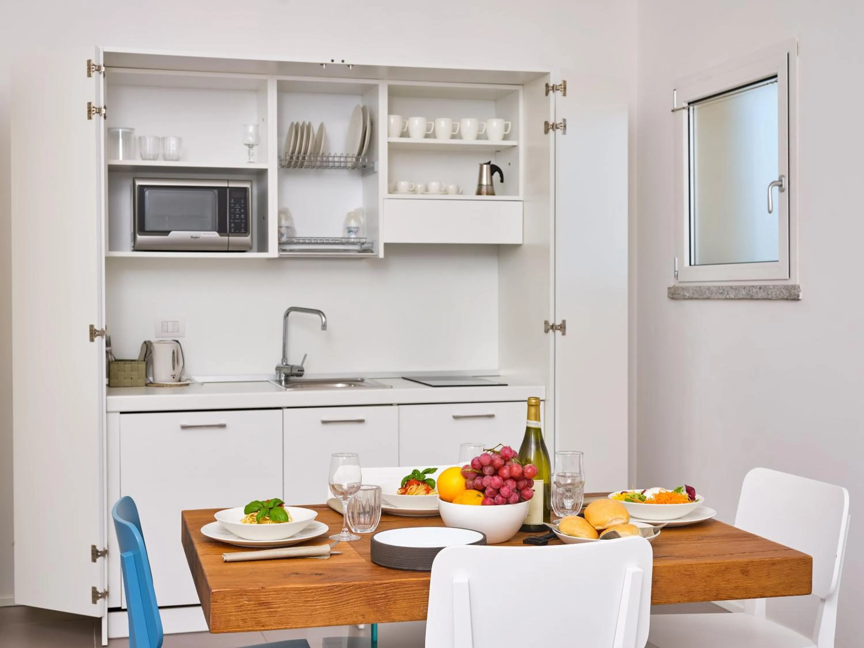 Kitchen or kitchenette in Felix Hotels - Hotel Residence Porto San Paolo