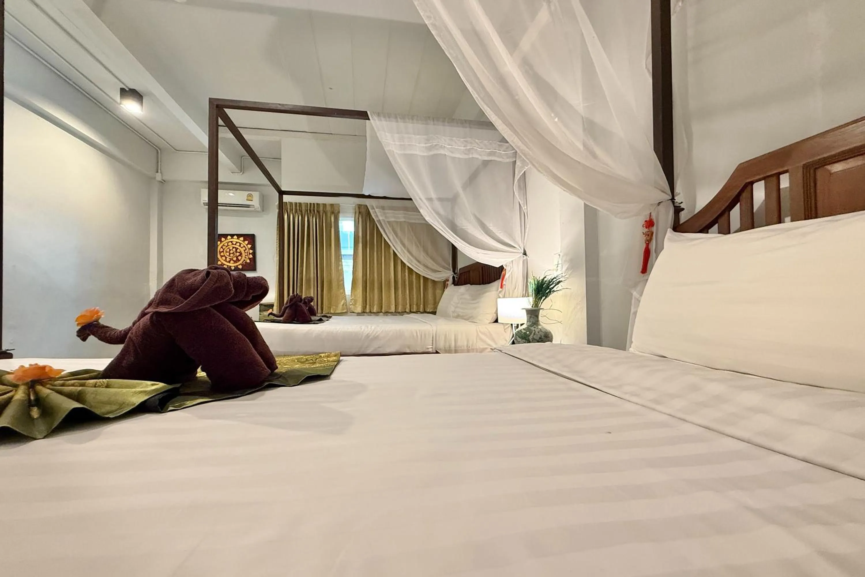 Bed in Sabaidee Chiangmai Hotel
