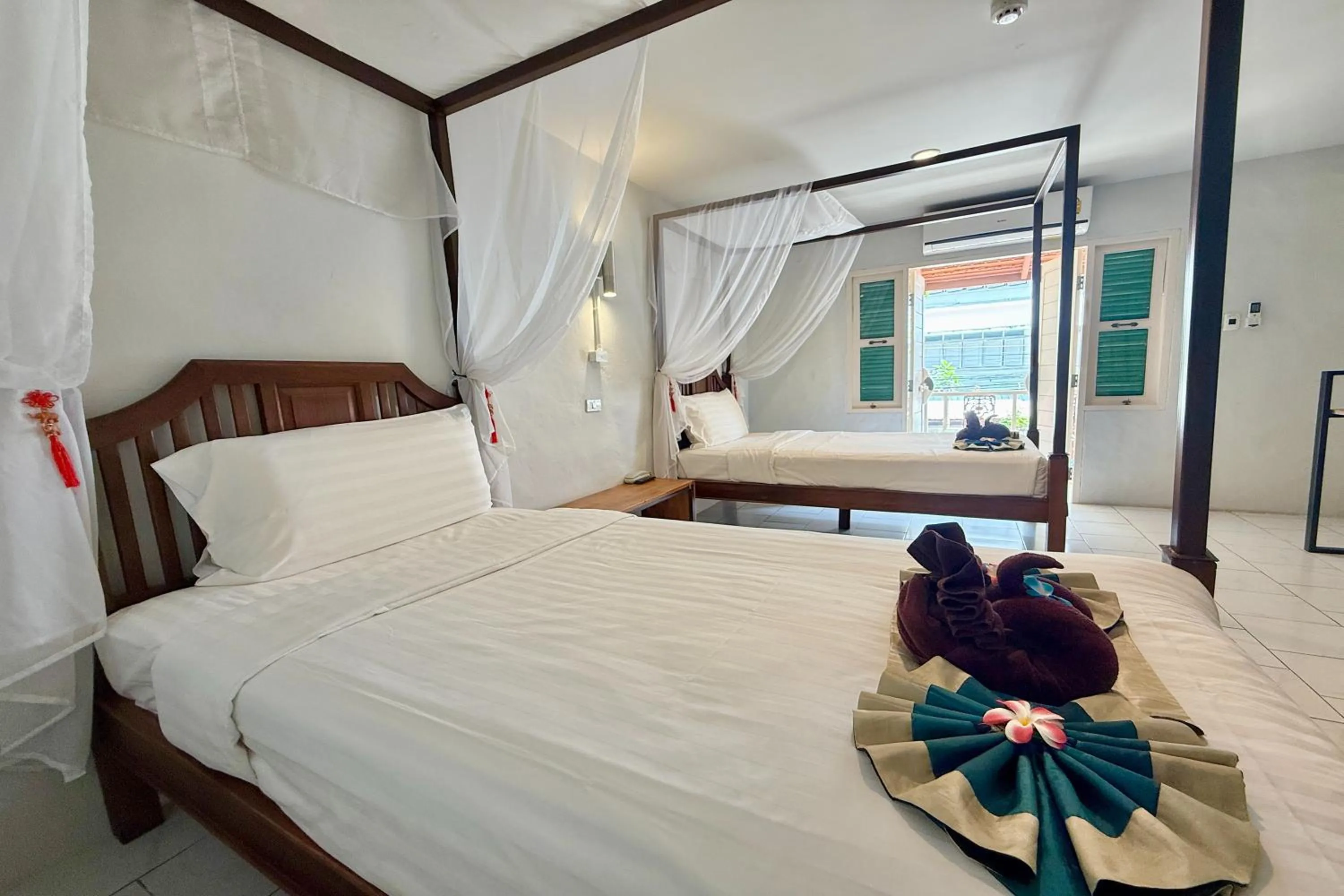 Bed in Sabaidee Chiangmai Hotel