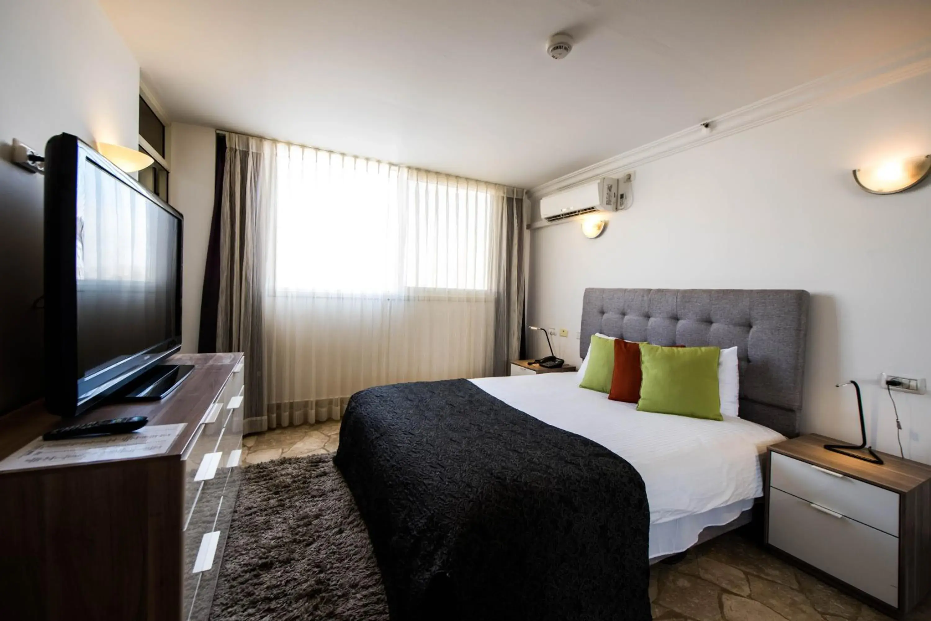 Bed in Ramon Suites by Smart Hotels Bed in Ramon Suites by Smart Hotels
