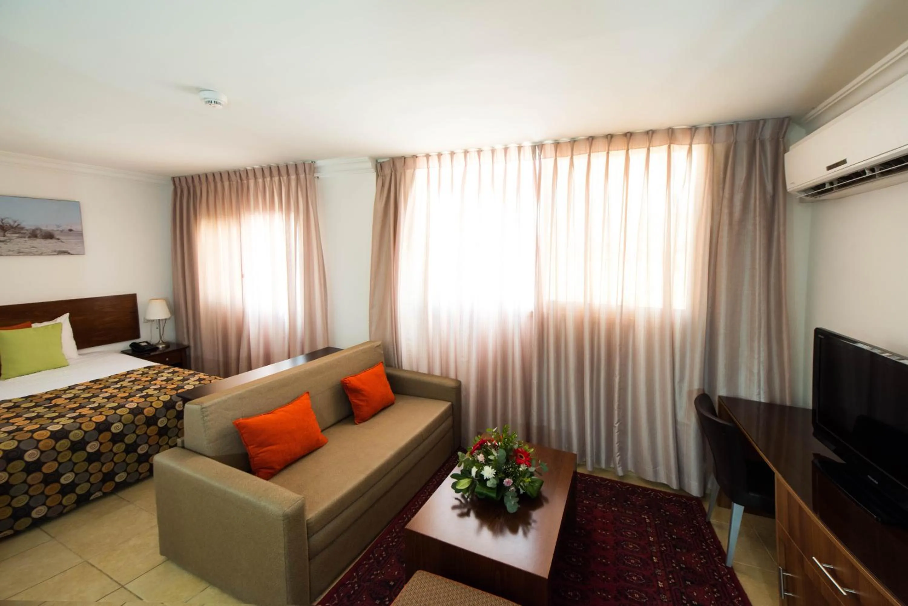 Seating area, Bed in Ramon Suites by Smart Hotels