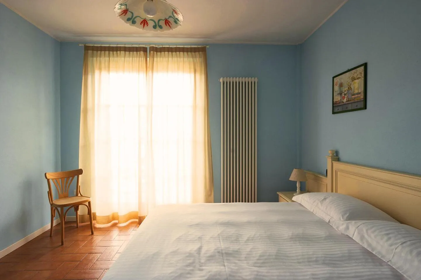 Bed in T'AMI Hotel Resort Spa