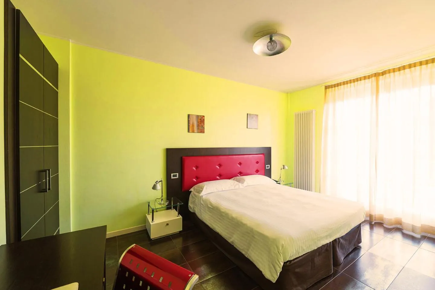 Bed in T'AMI Hotel Resort Spa