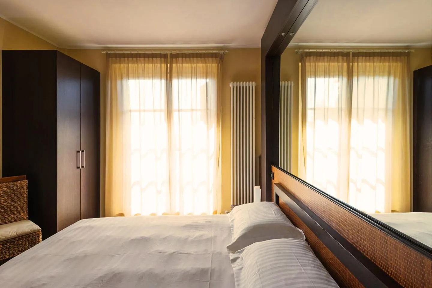 Bed in T'AMI Hotel Resort Spa