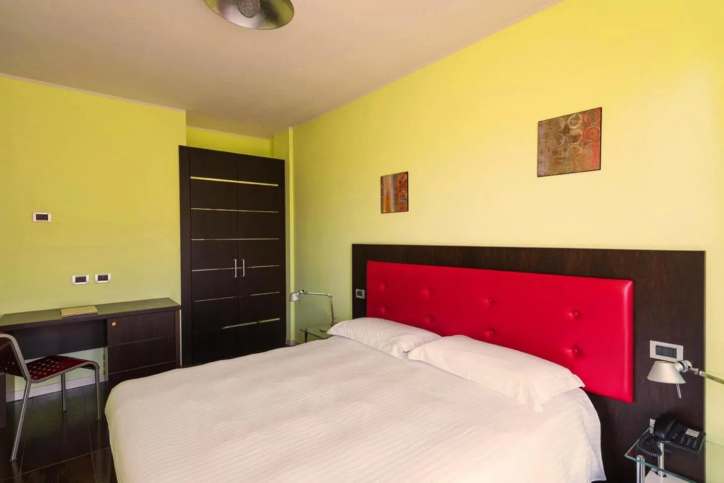 Bed in T'AMI Hotel Resort Spa