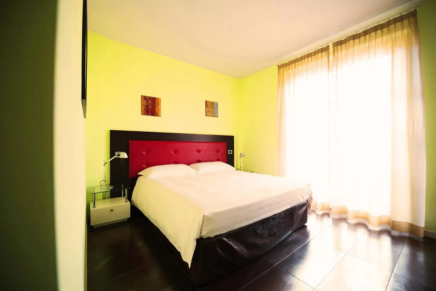 Bed in T'AMI Hotel Resort Spa