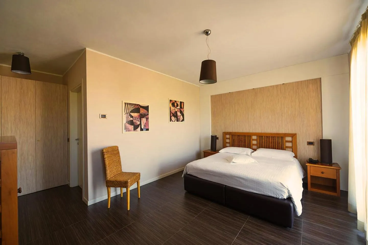 Bed in T'AMI Hotel Resort Spa