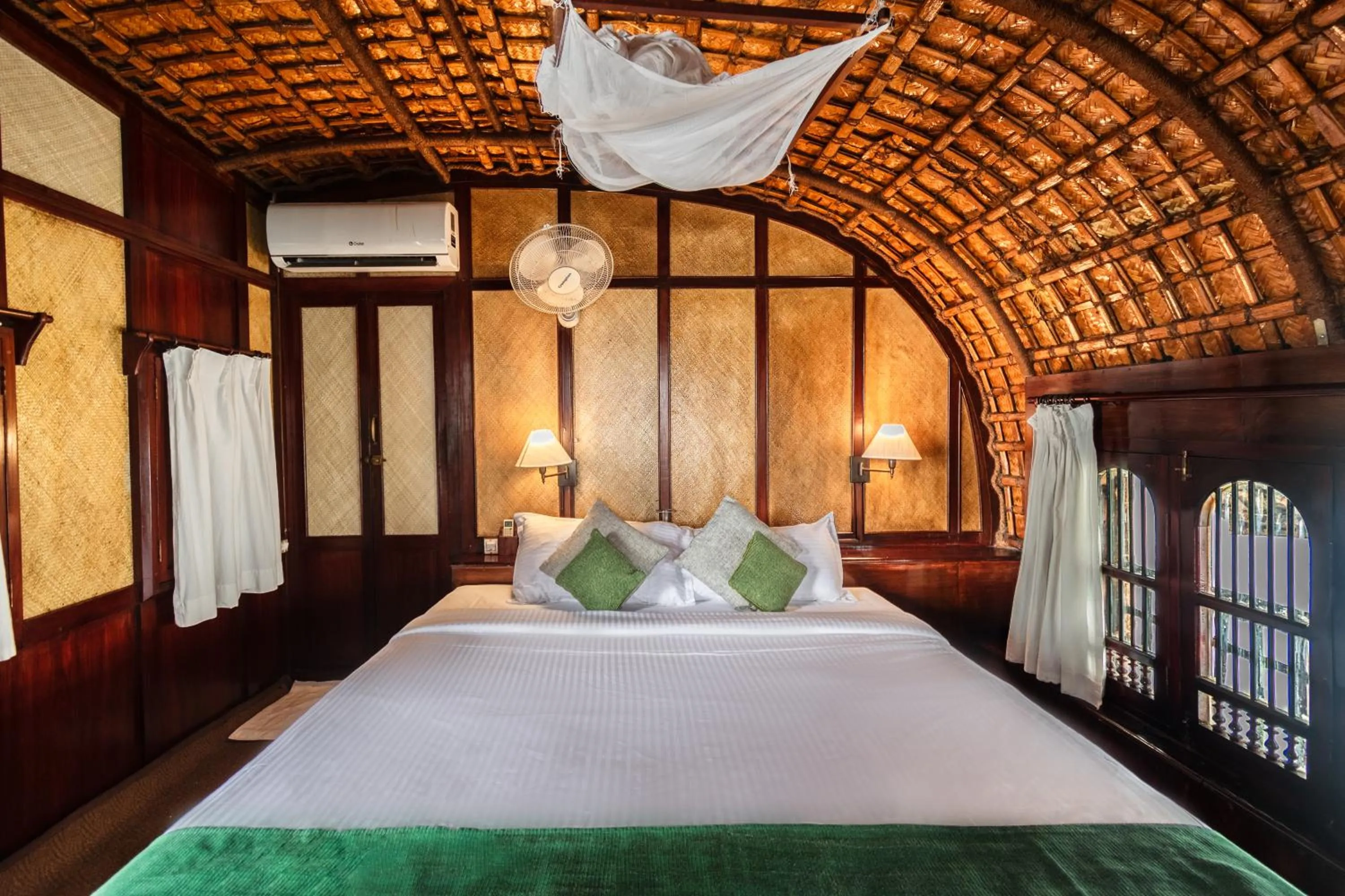 Bed in Spice Coast Cruises - Houseboat, A CGH Earth Experience