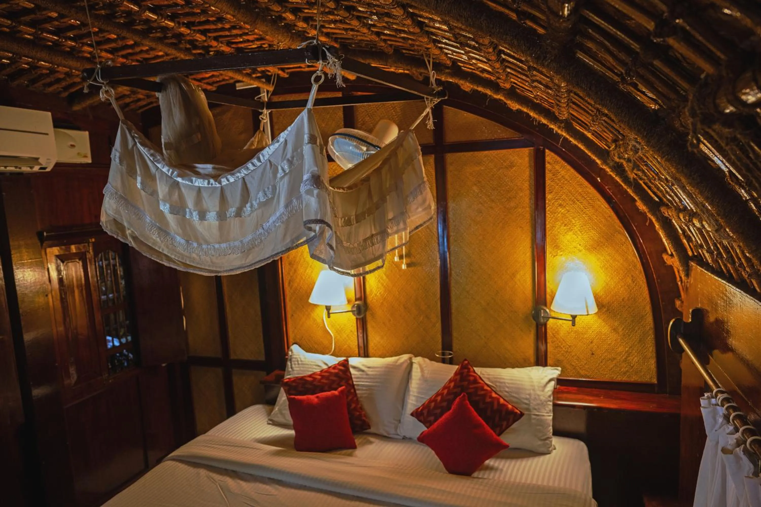 Bed in Spice Coast Cruises - Houseboat, A CGH Earth Experience