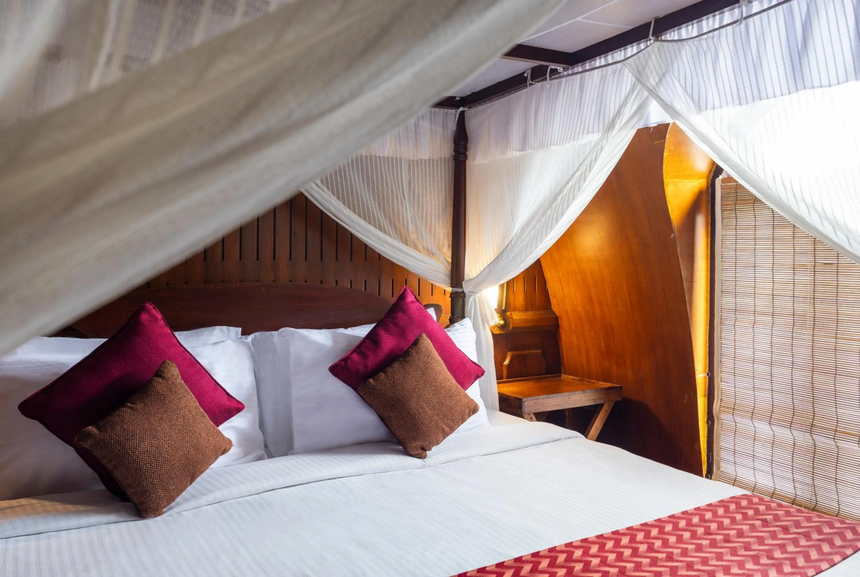 Bed in Spice Coast Cruises - Houseboat, A CGH Earth Experience