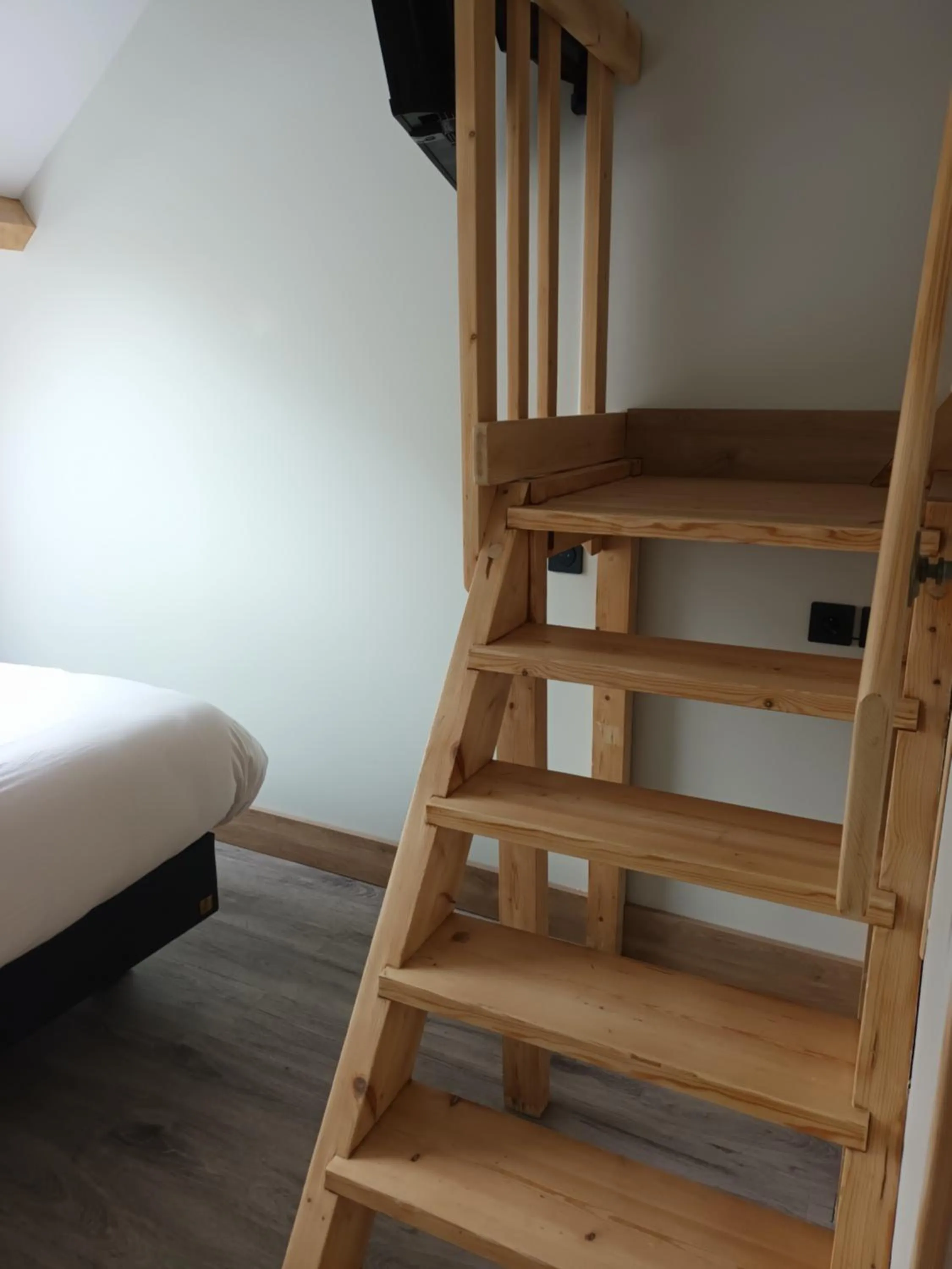 Photo of the whole room, Bed in Hôtel-Restaurant Logis l'Aubrac Laguiole