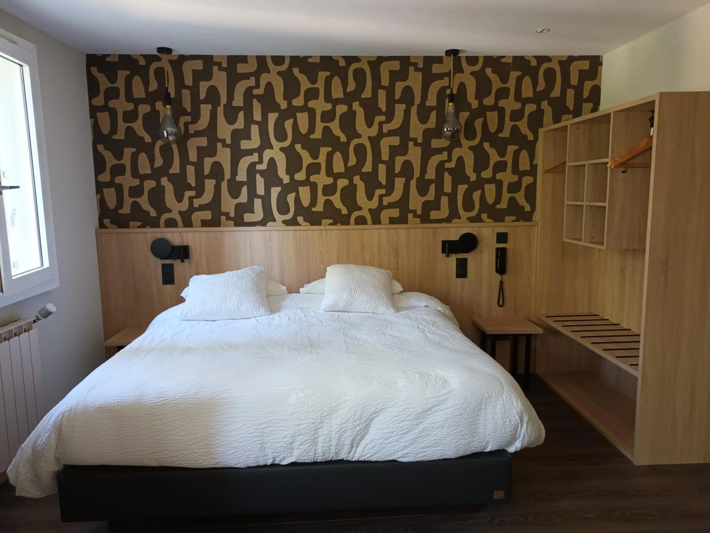 Bed in Hôtel-Restaurant Logis l'Aubrac Laguiole