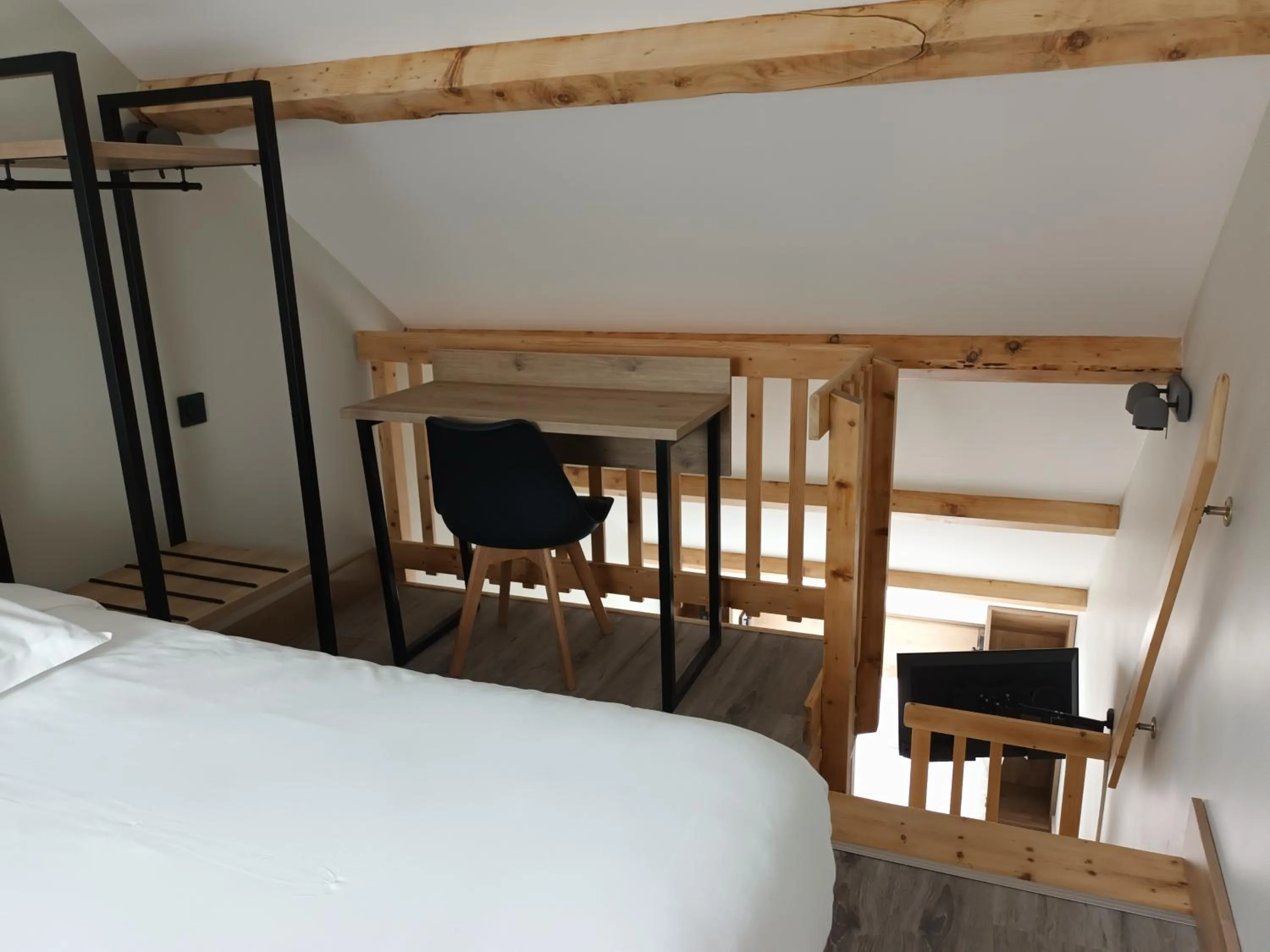 Photo of the whole room, Bed in Hôtel-Restaurant Logis l'Aubrac Laguiole