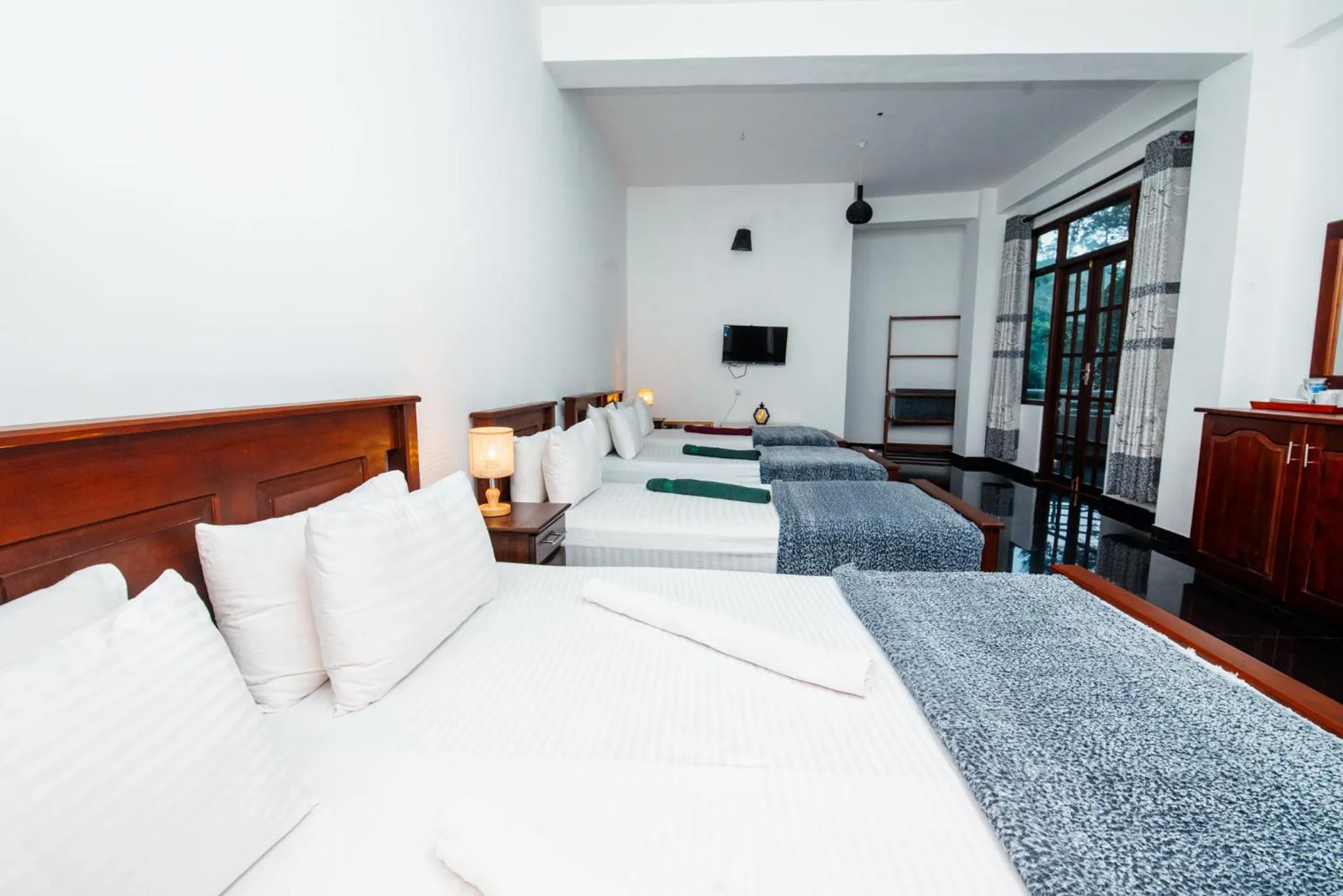 Bed in Adams Peak Inn