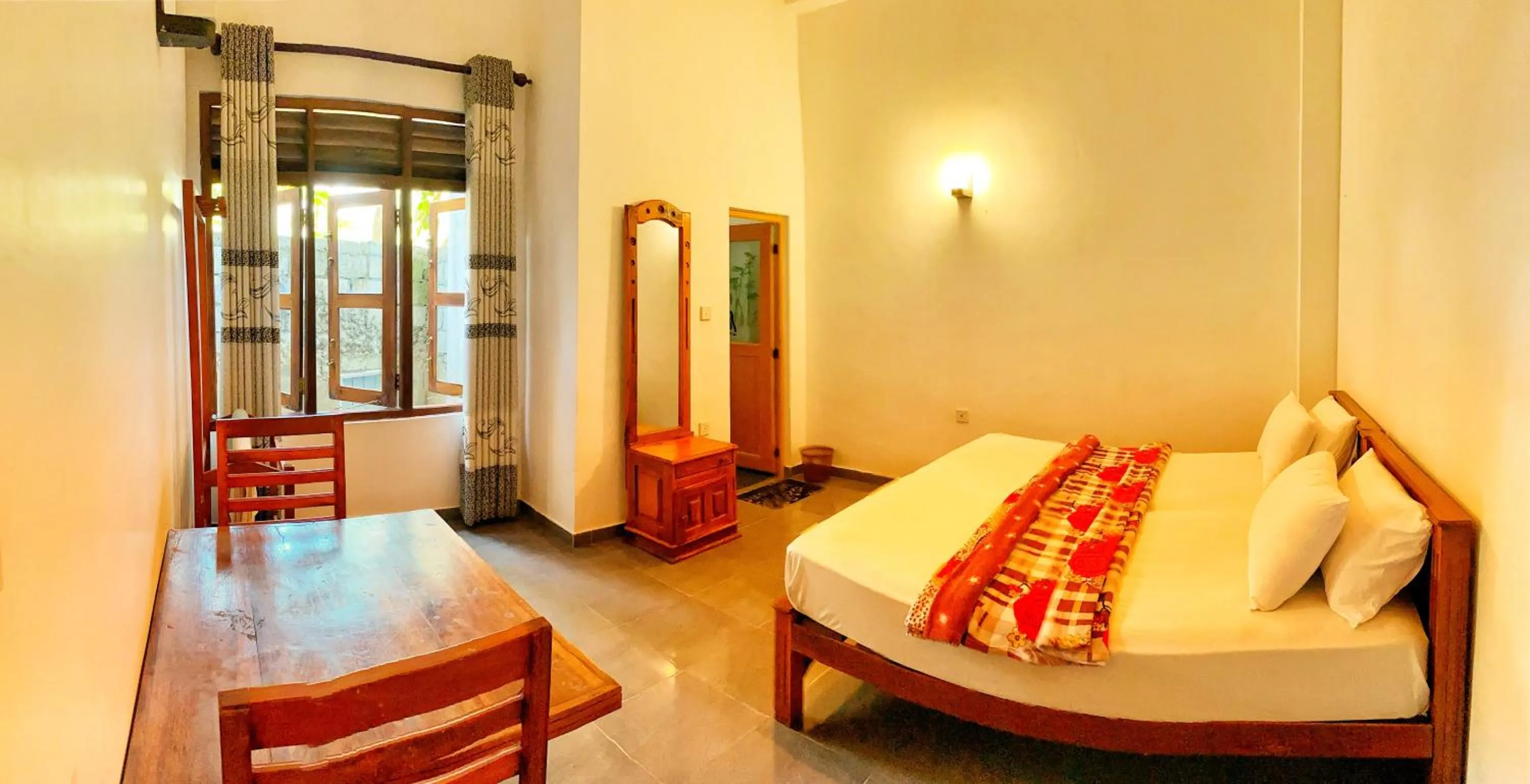 Bed in Adams Peak Inn