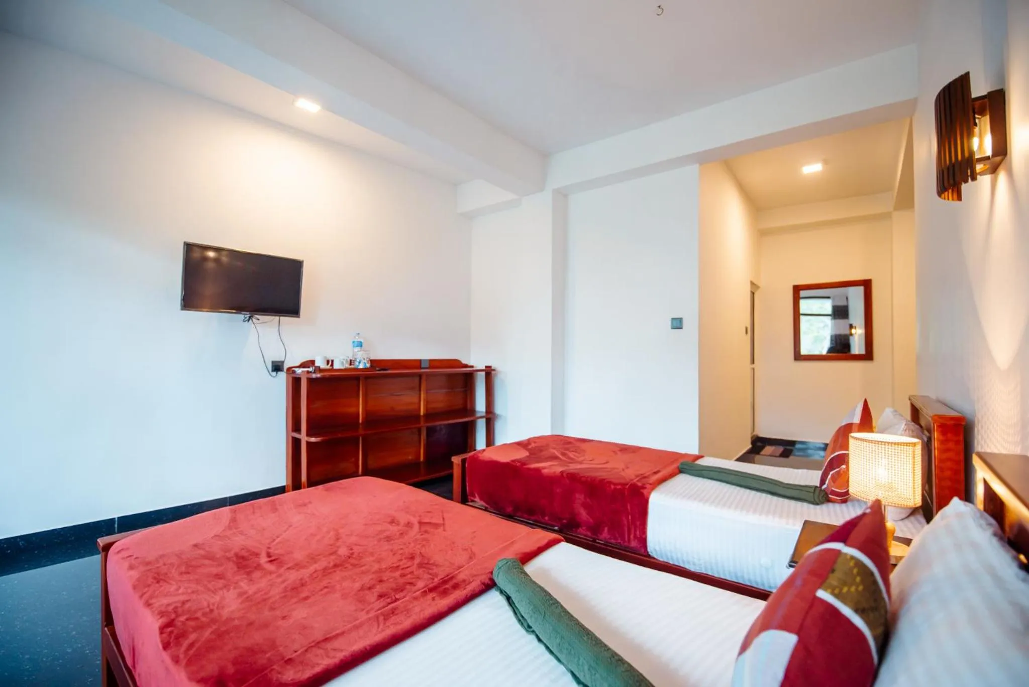 Bed in Adams Peak Inn