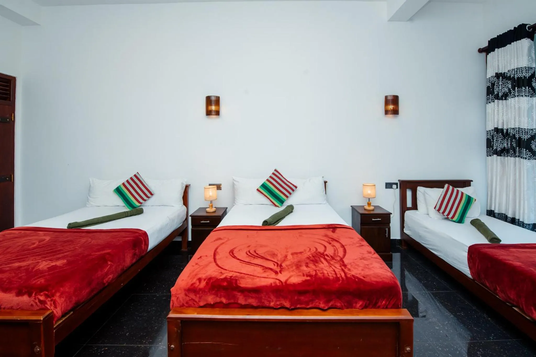 Bed in Adams Peak Inn