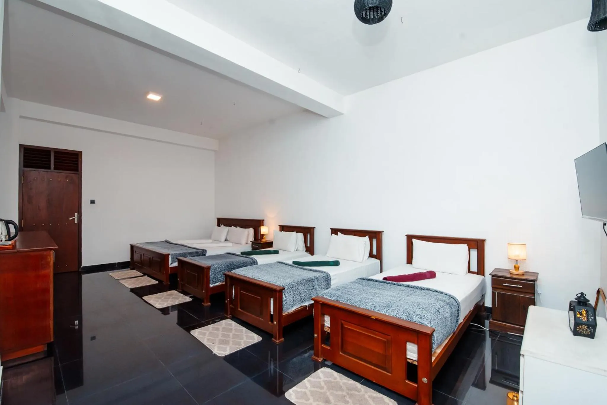 Bed in Adams Peak Inn