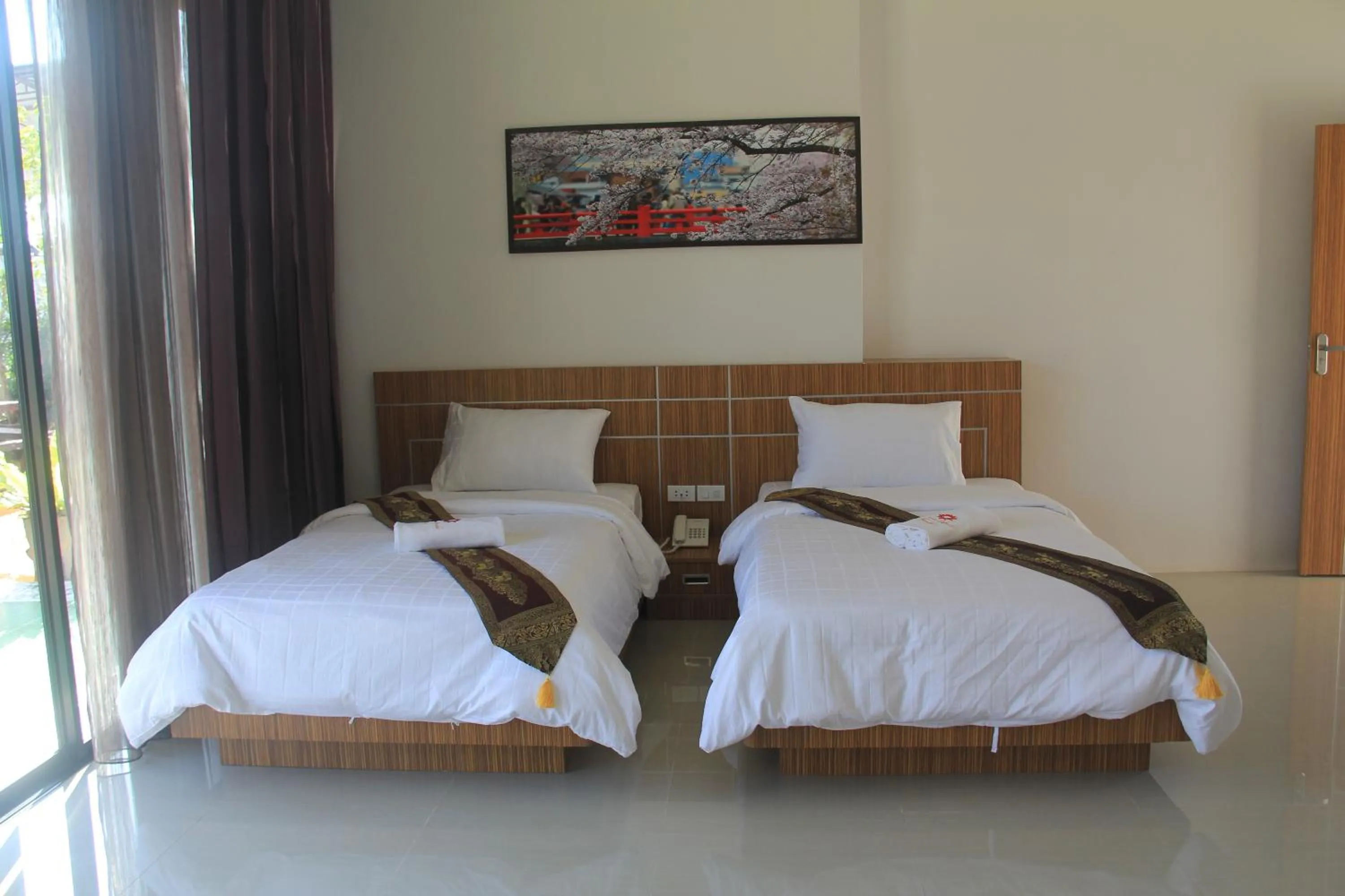 Bed in Tawan Anda Garden Hotel