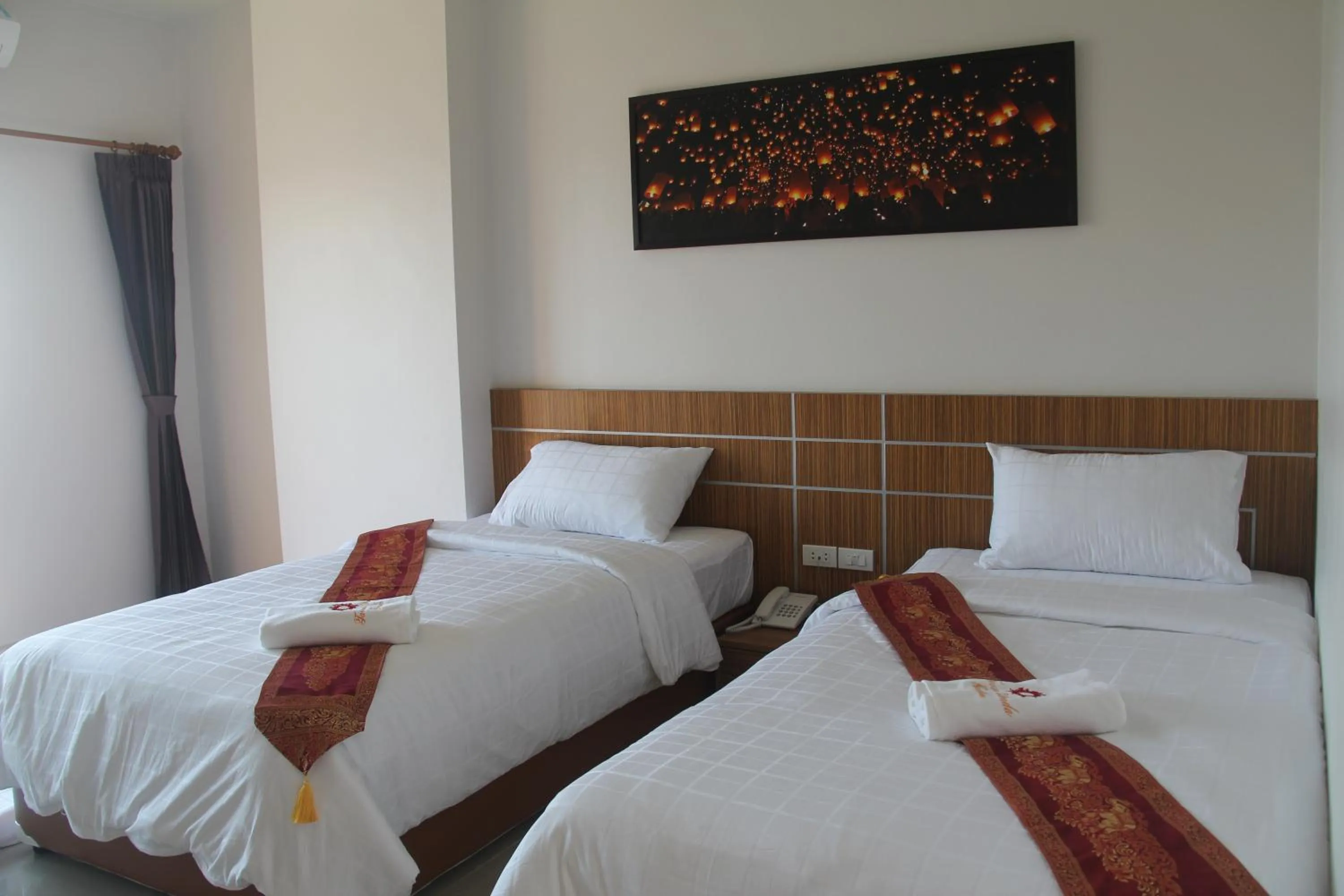 Bed in Tawan Anda Garden Hotel