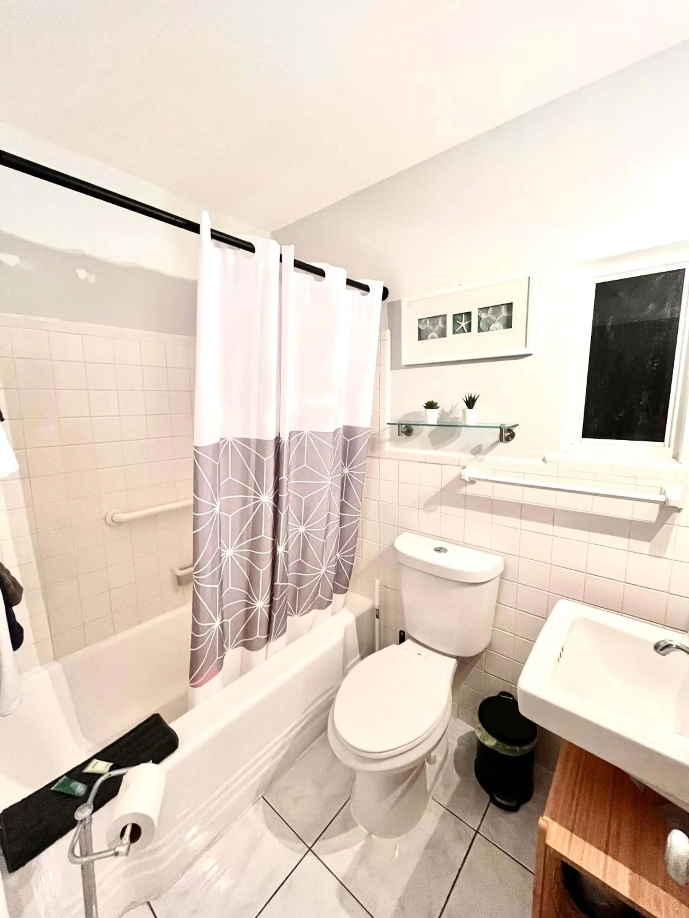 Bathroom in 4145 By The Sea Inn & Suites