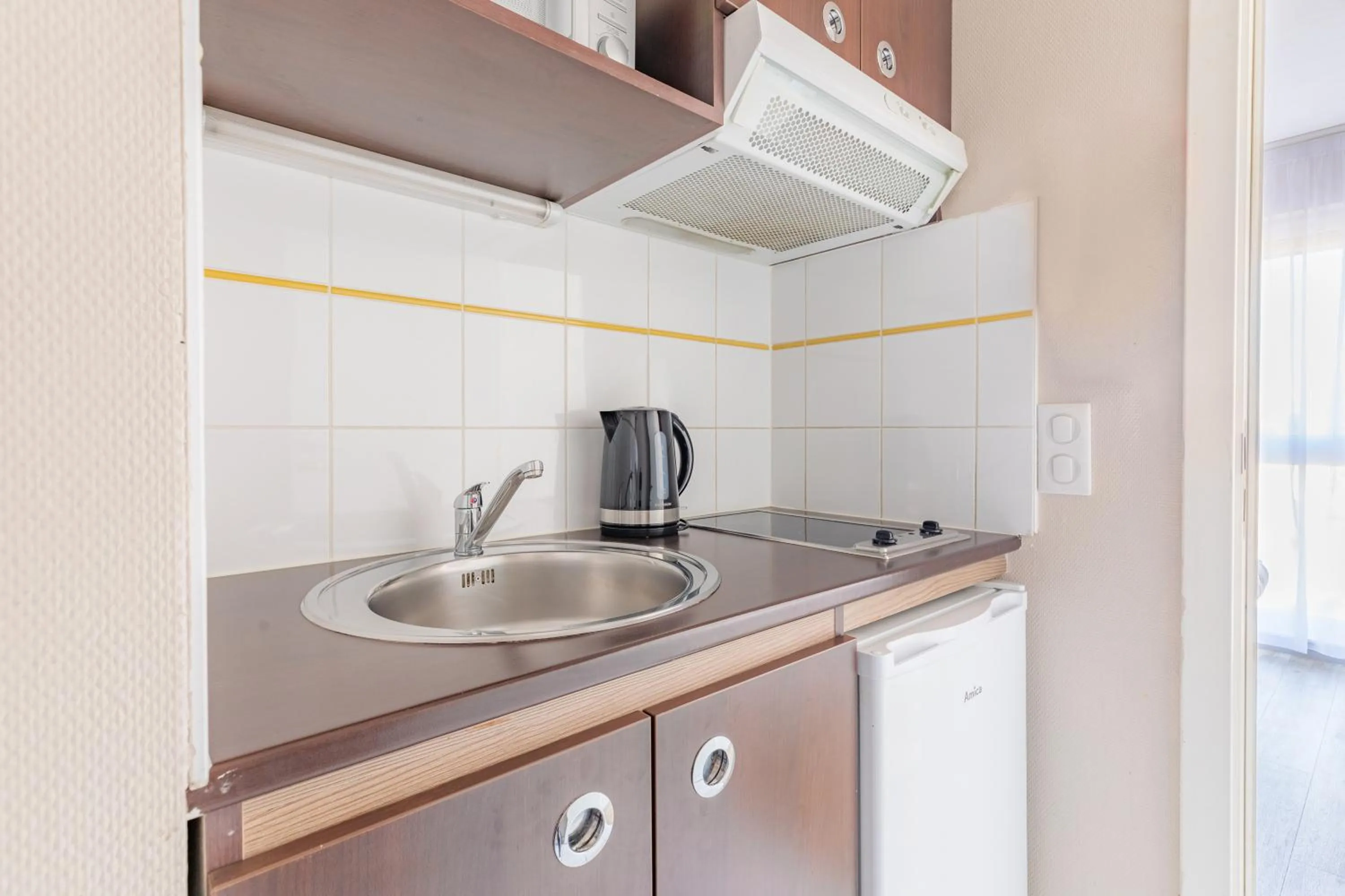 Kitchen or kitchenette in Appart'City Classic Arlon - Porte du Luxembourg