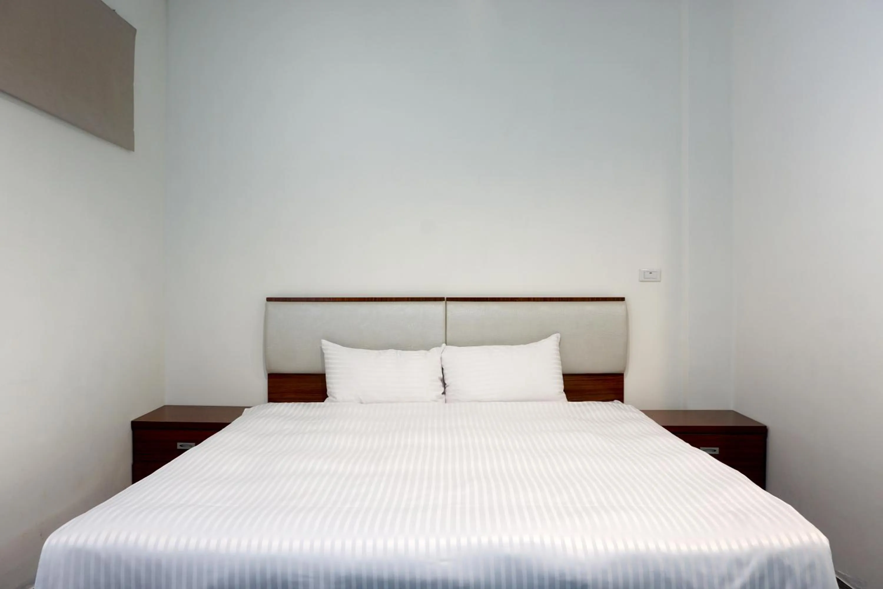 Bed in NCNU Campus Inn暨大行旅