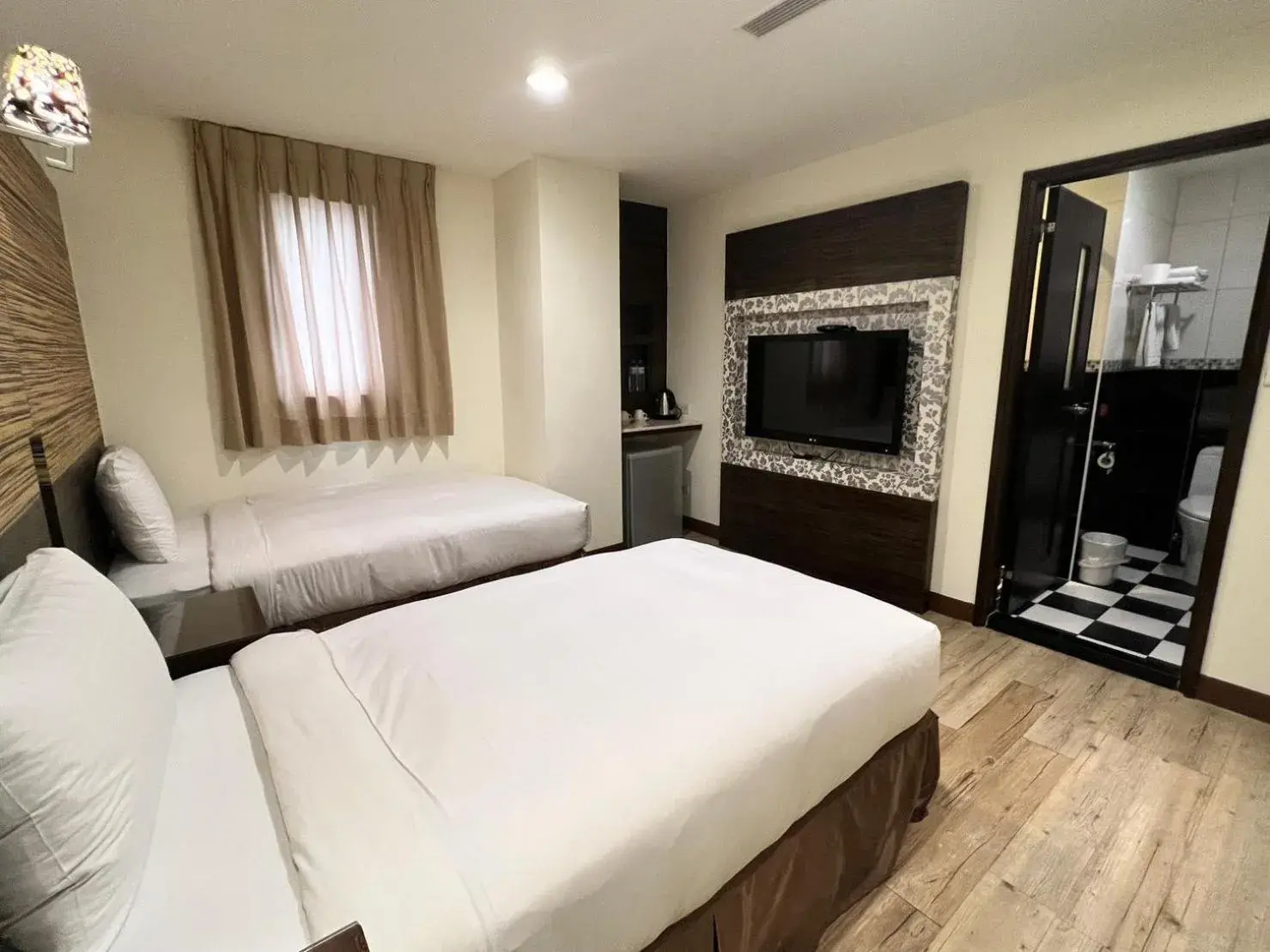 Bed in Kaishen Hotel Bed in Kaishen Hotel