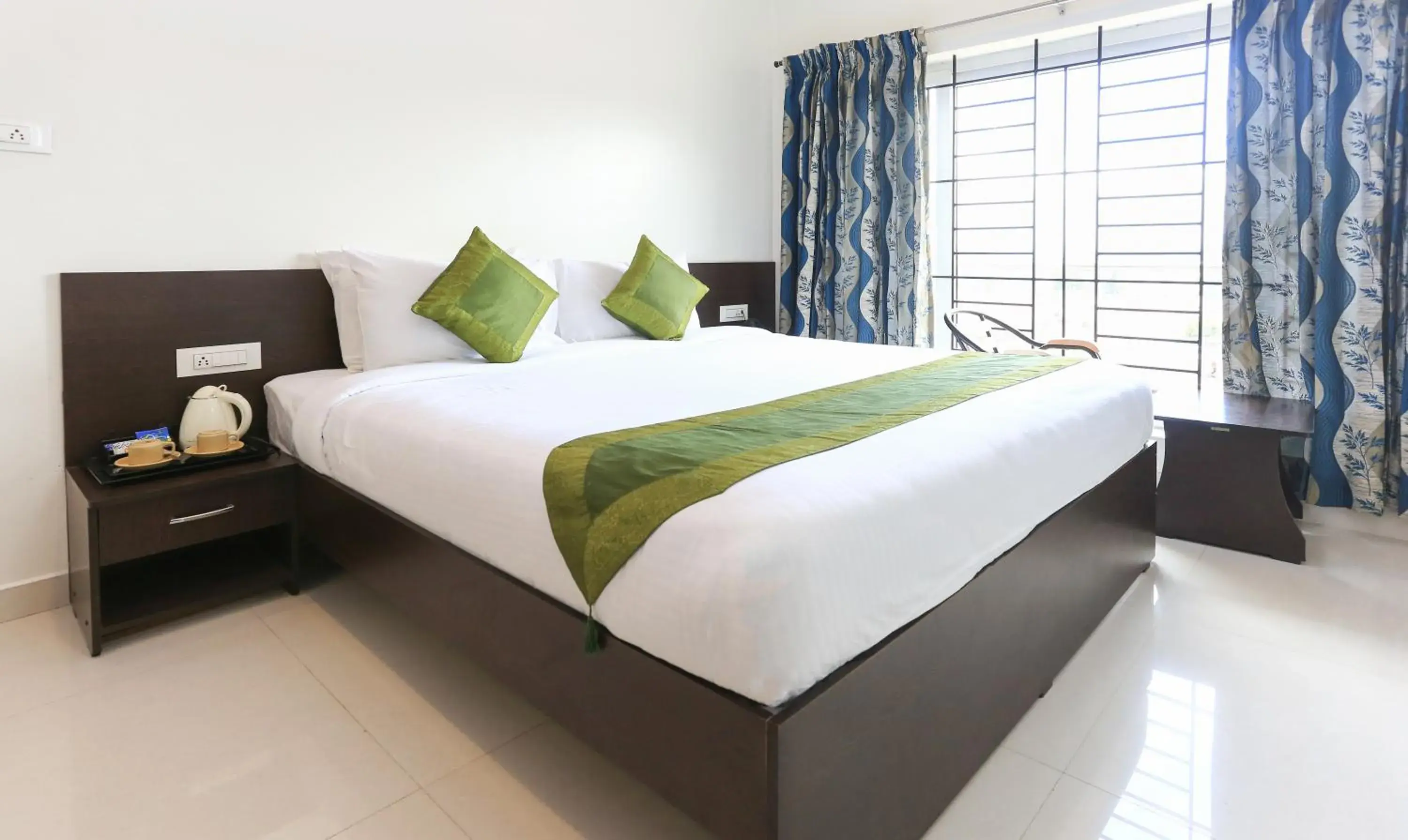 Bed in Treebo Light House, 900 Mtrs From Botanical Garden Bed in Treebo Light House, 900 Mtrs From Botanical Garden