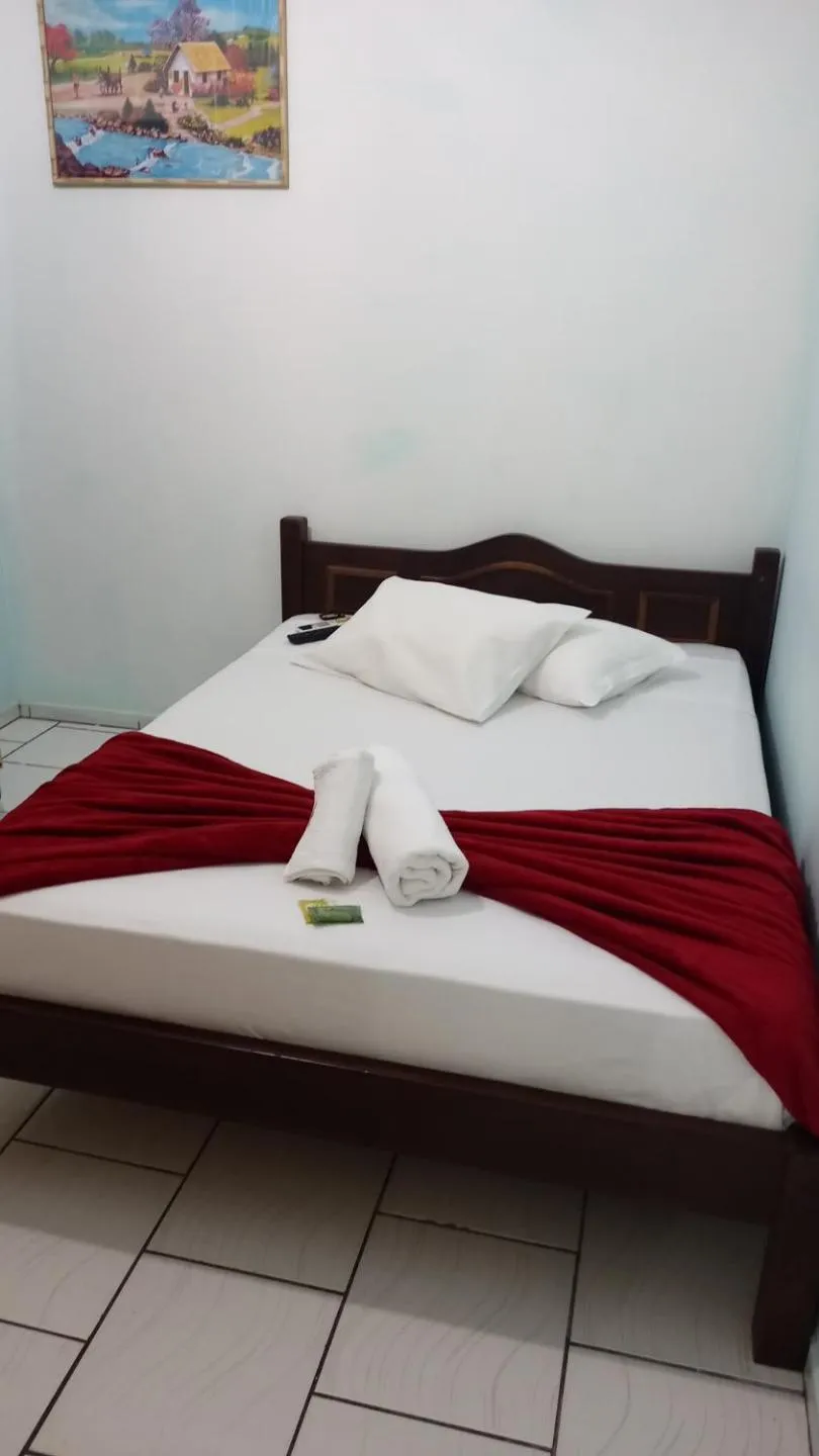 Bed in Pousada Oliveira