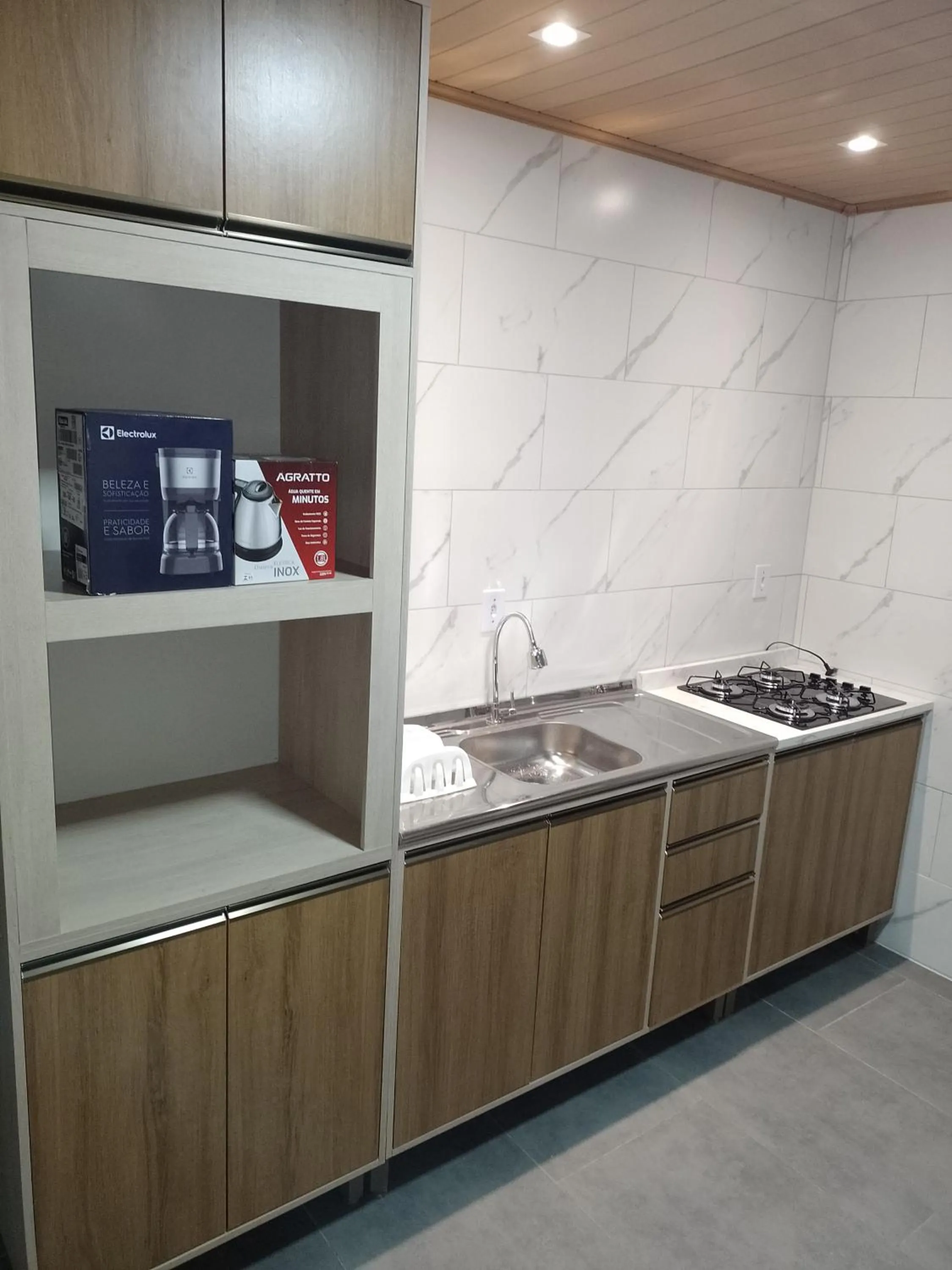 Kitchen or kitchenette in Pousada Oliveira