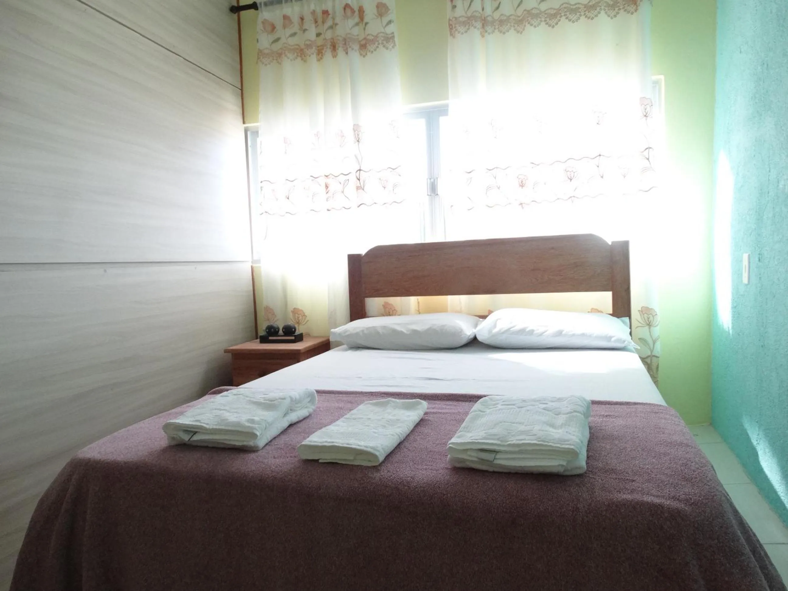 Bed in Pousada Oliveira