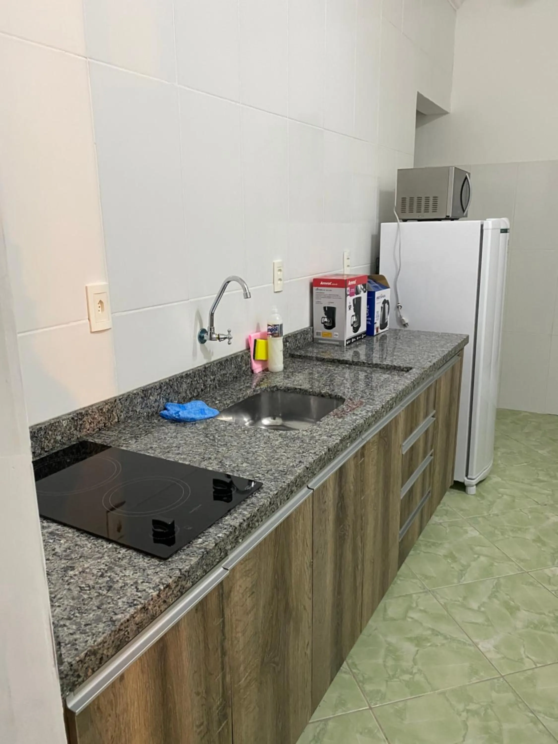 Kitchen or kitchenette in Pousada Oliveira