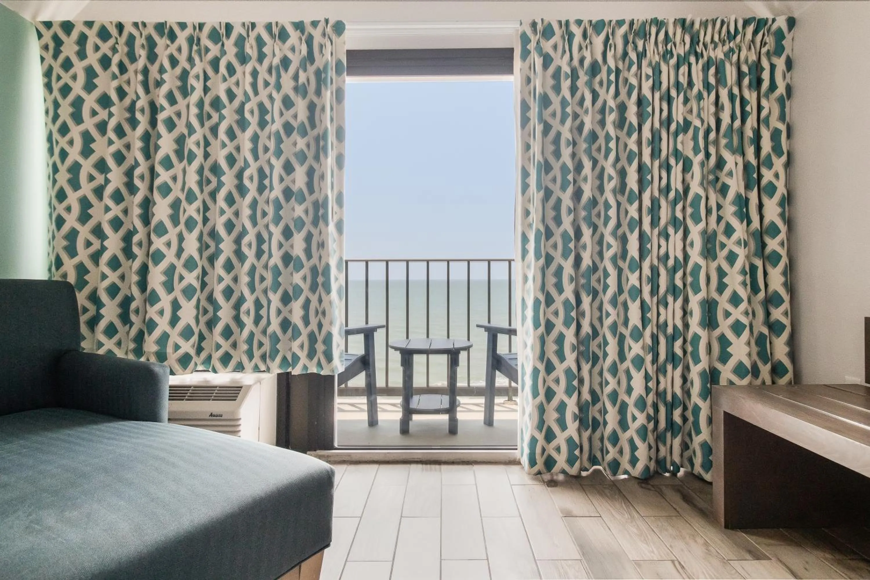 Bed in Crystal Coast Oceanfront Hotel