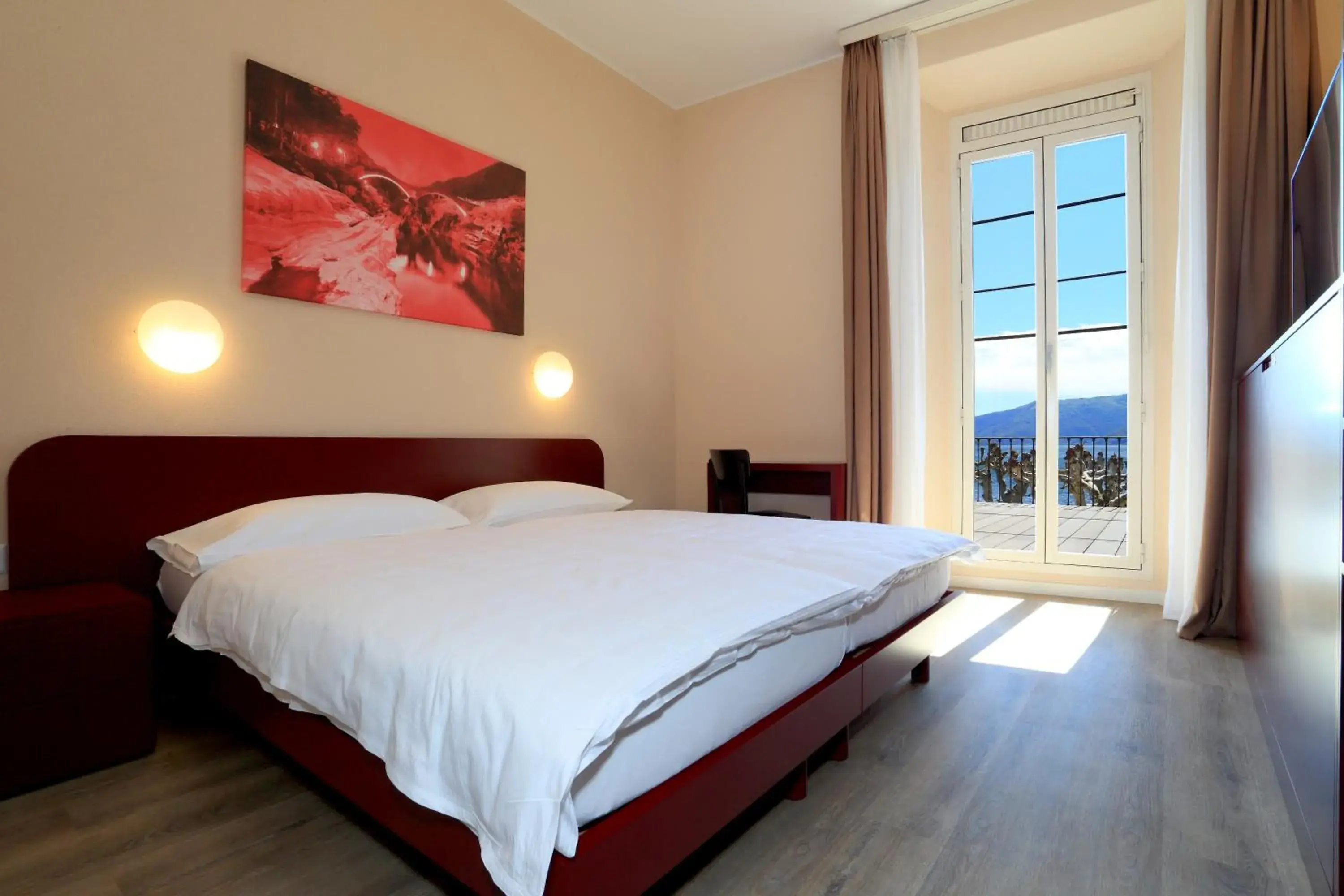 Balcony/Terrace, Bed in Hotel Elvezia Ascona Balcony/Terrace, Bed in Hotel Elvezia Ascona