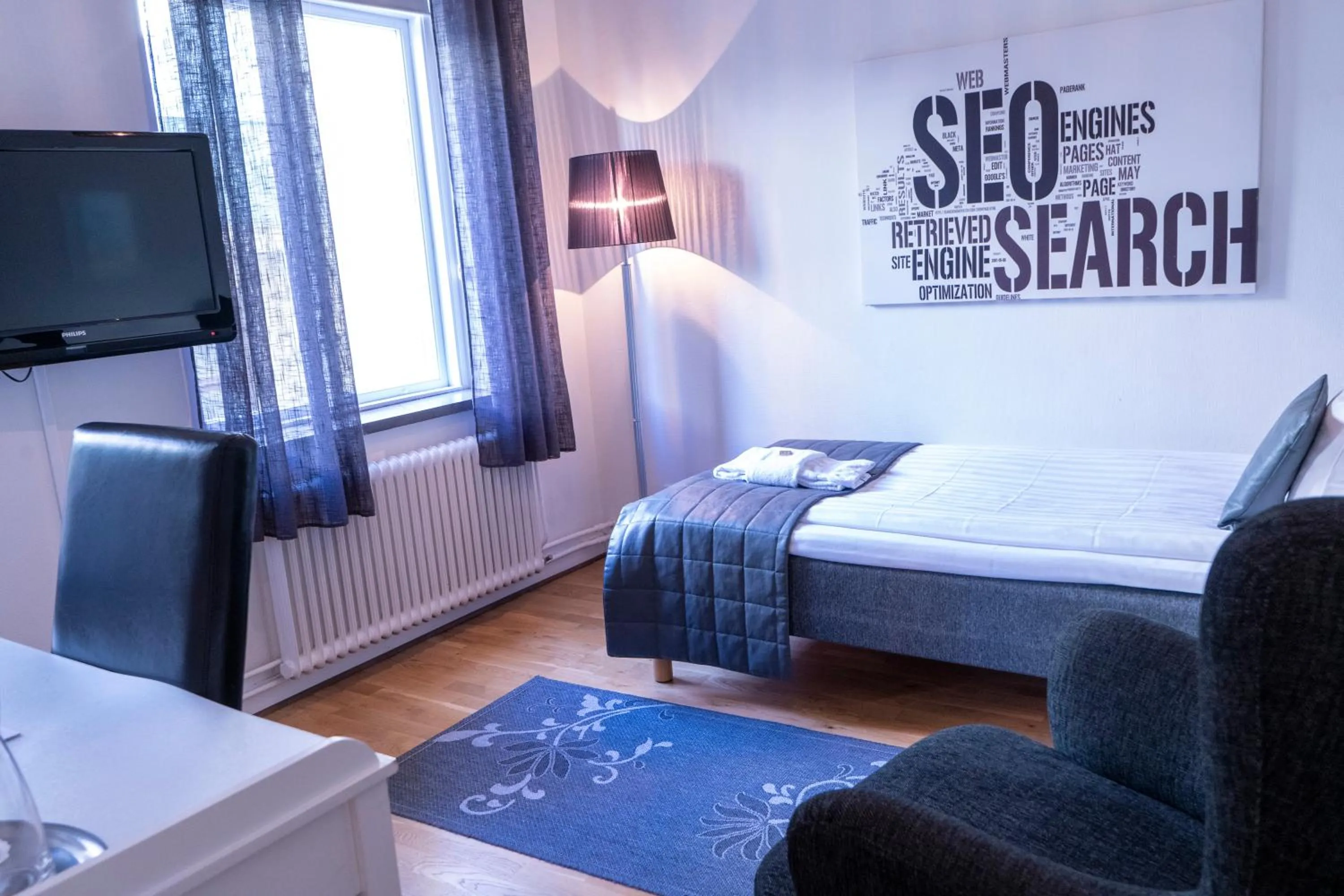 Photo of the whole room, Bed in Stadshotellet Kristianstad