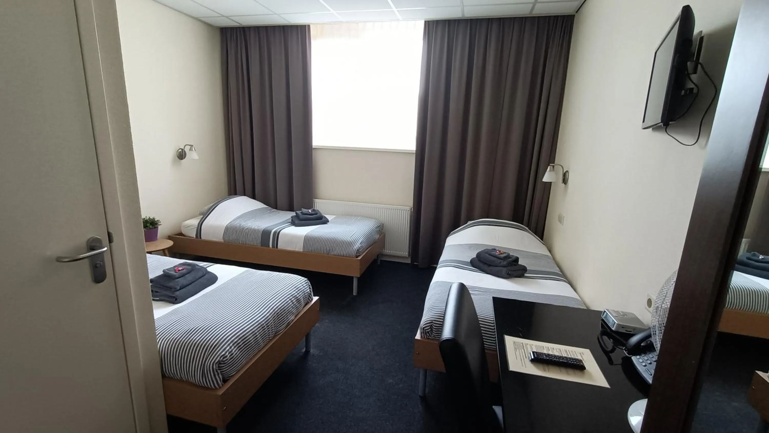 Bed in Hotel Rozenburg