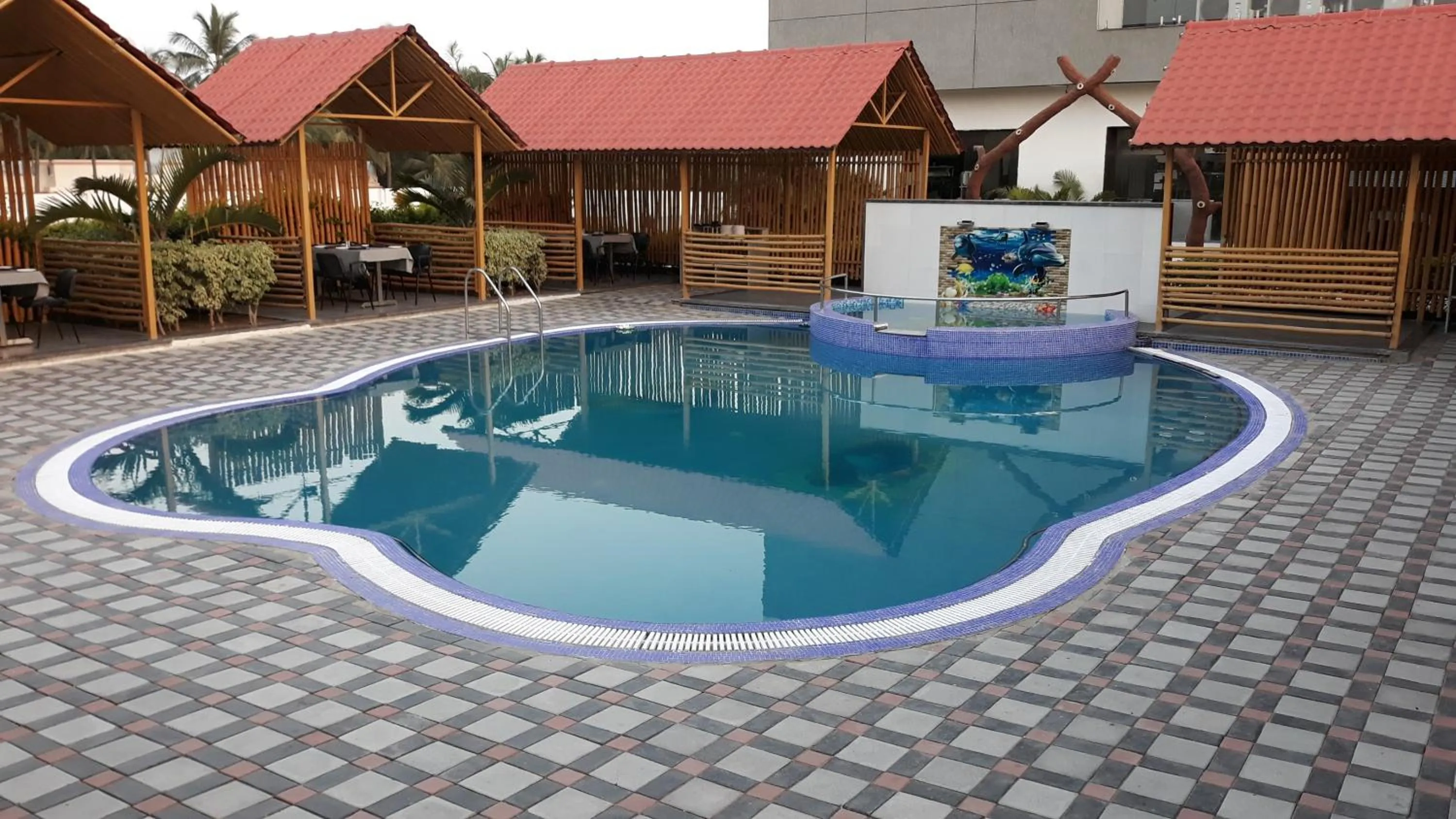 Swimming pool in The Divine Resort Somnath
